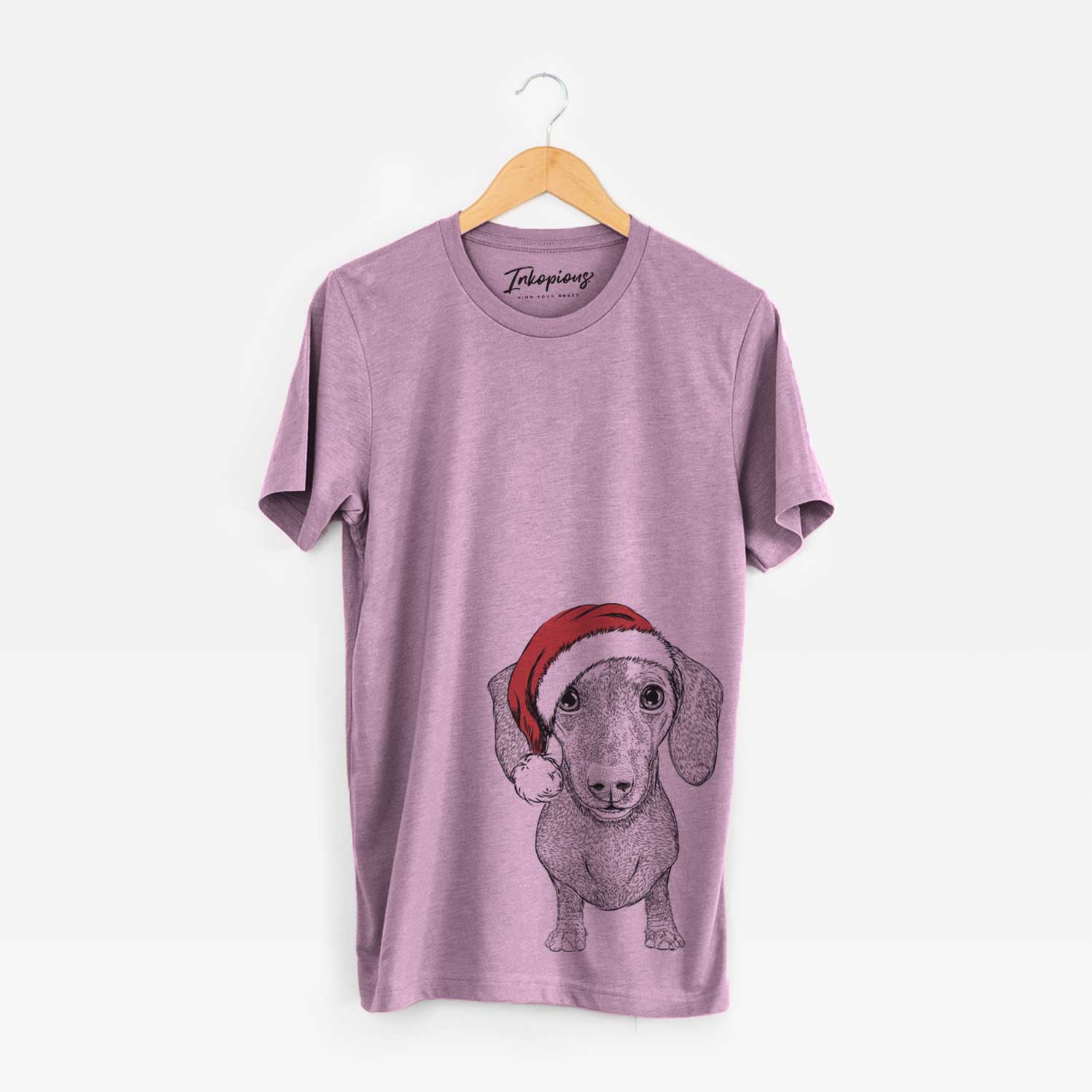 Hand-drawn sketch of Ernie the Mini Dachshund wearing a Santa hat on an Orchid Unisex crewneck
