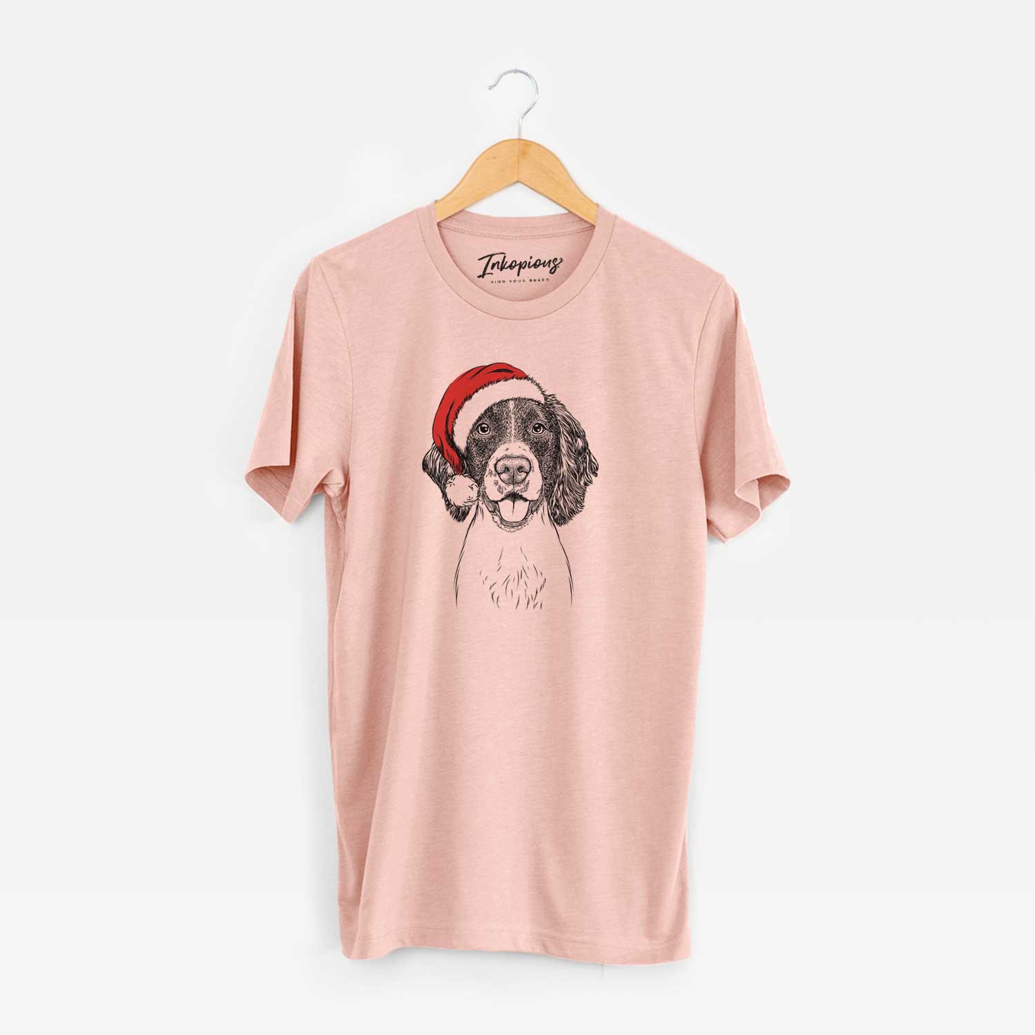 Hand-drawn sketch of Ever the English Springer Spaniel wearing a Santa hat on a Peach Unisex crewneck
