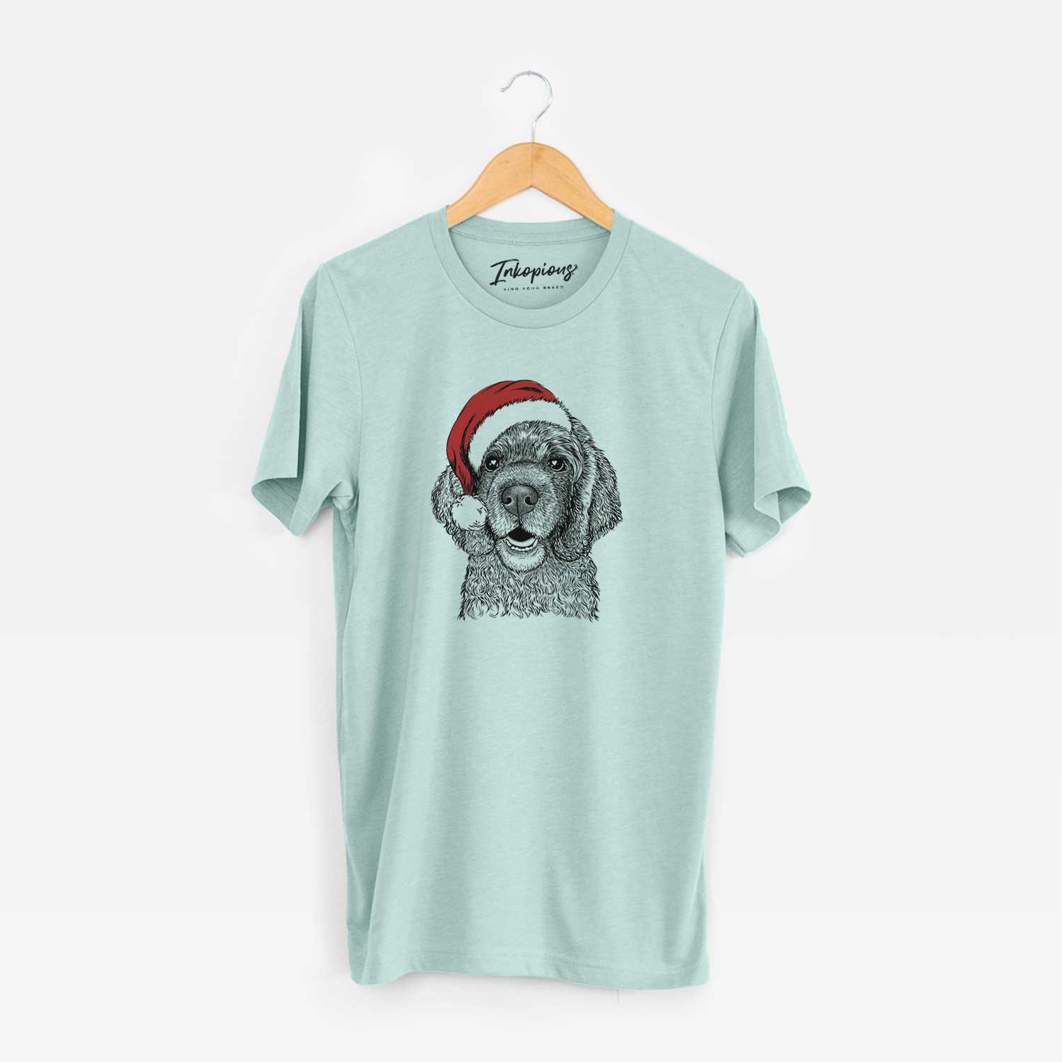 Hand-drawn sketch of Fannie Mae the Cocker Spaniel wearing a Santa hat on a Heather Sage Unisex crewneck