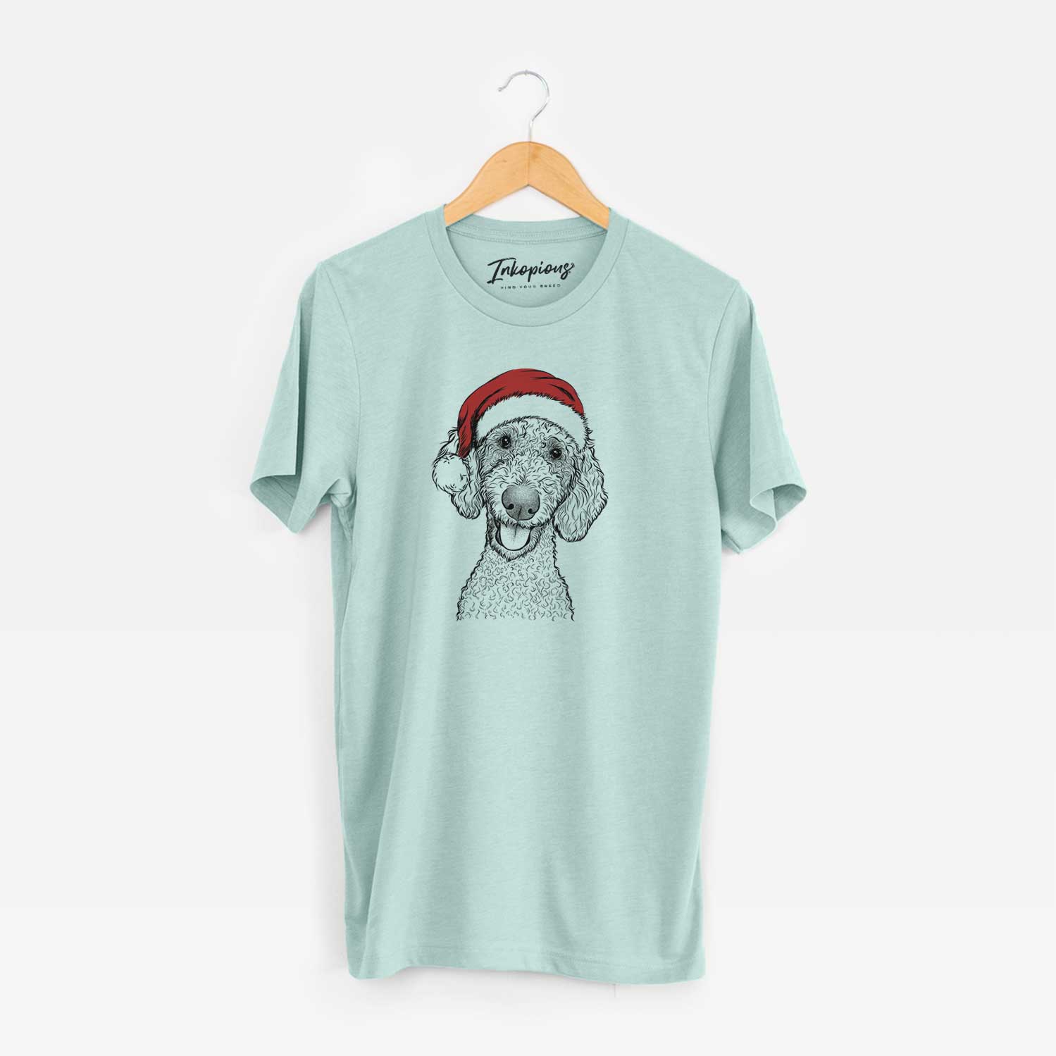 Hand-drawn sketch of Fenway the Goldendoodle wearing a Santa hat on a Heather Sage Unisex crewneck