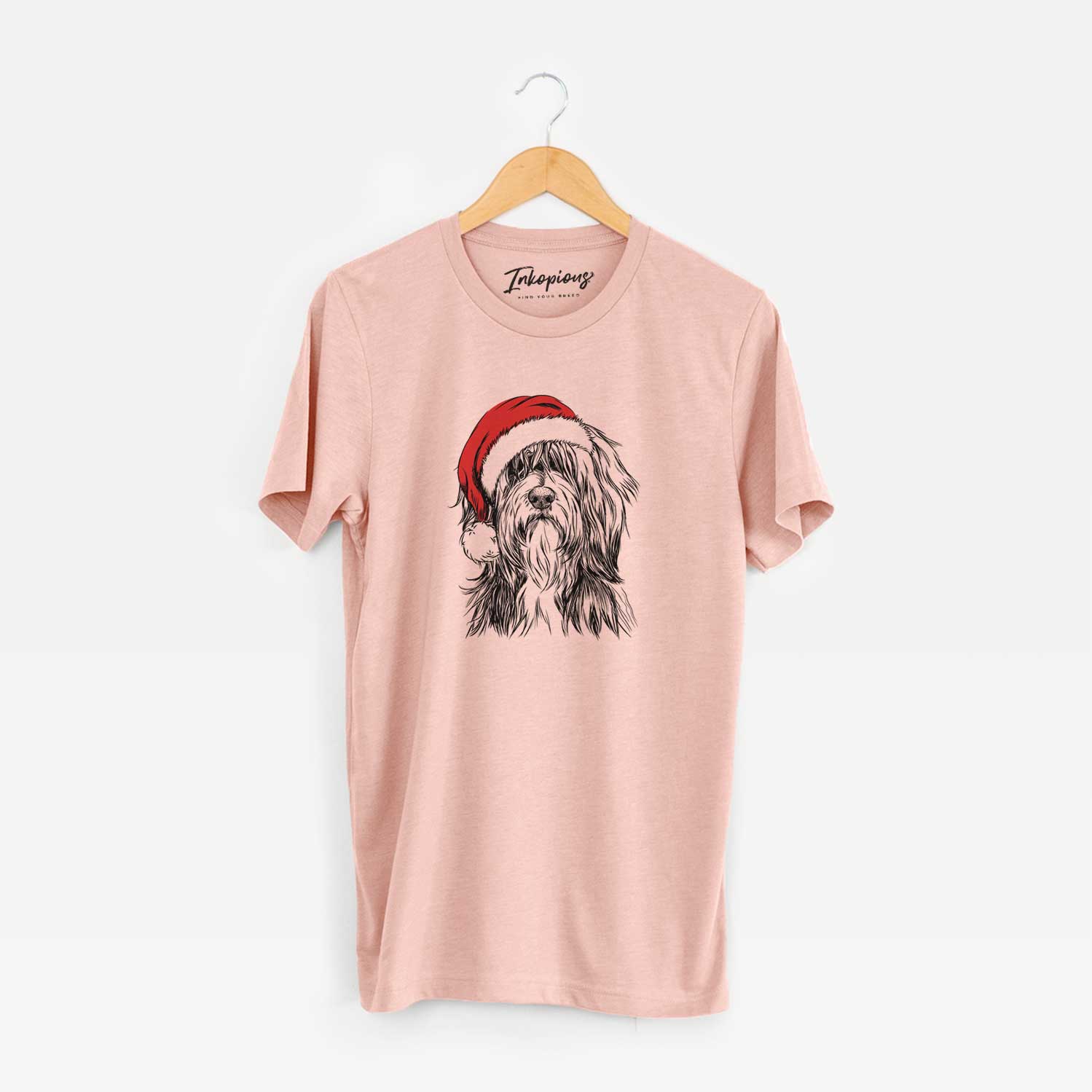 Hand-drawn sketch of Fiji the Polish Lowland Sheepdog wearing a Santa hat on a Peach Unisex crewneck