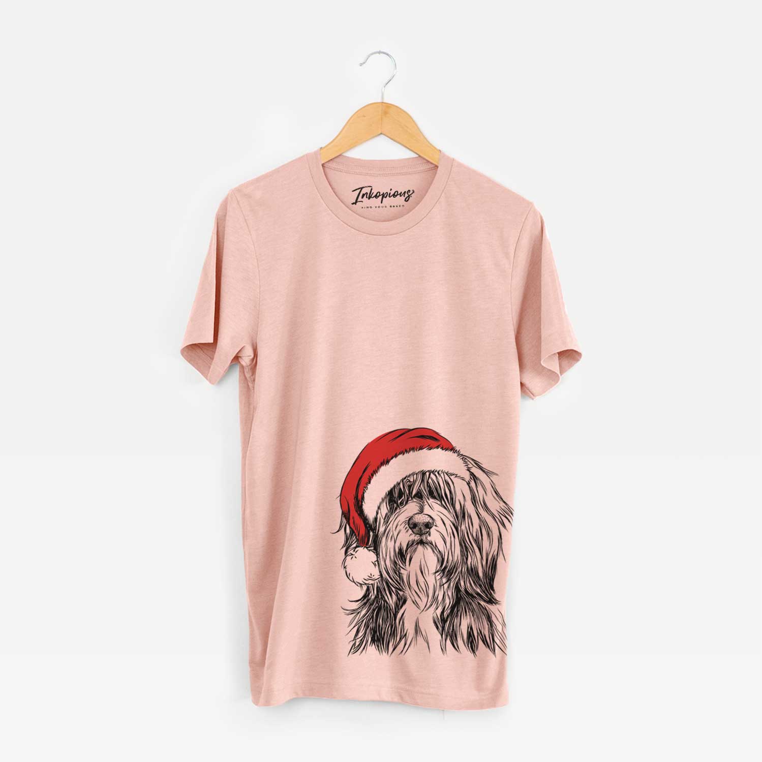 Hand-drawn sketch of Fiji the Polish Lowland Sheepdog wearing a Santa hat on a Peach Unisex crewneck