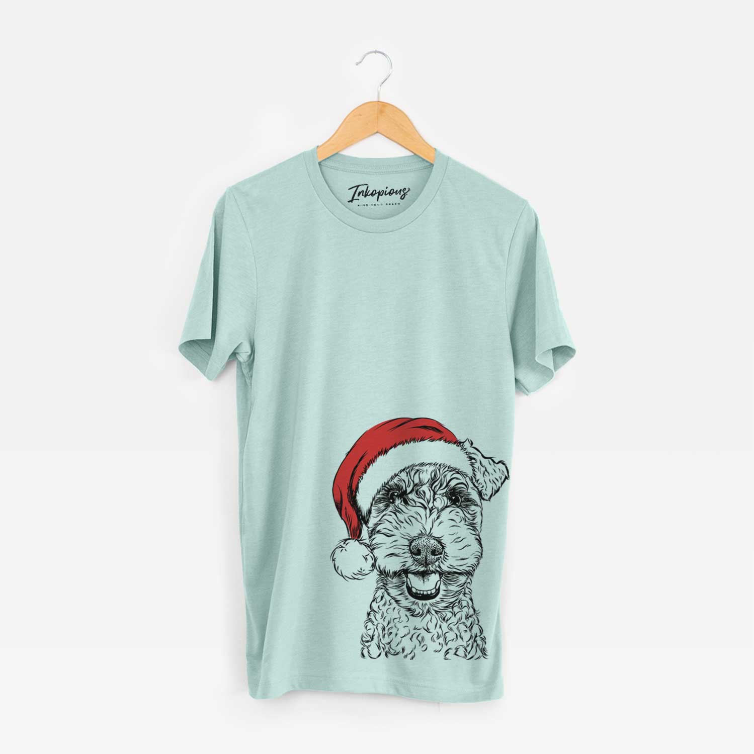 Hand-drawn sketch of Fintan the Irish Troodle wearing a Santa hat on a Heather Sage Unisex crewneck