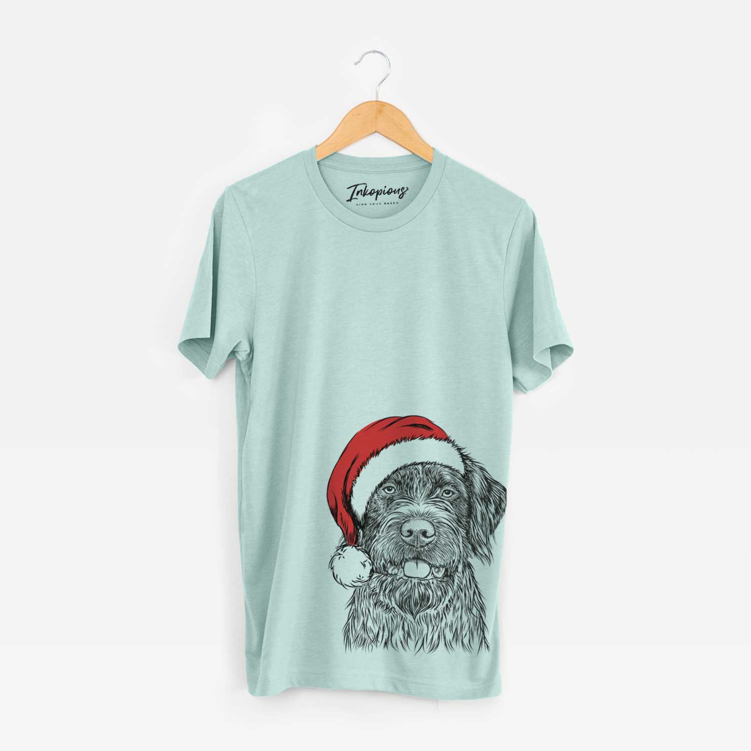 Hand-drawn sketch of Fletcher the Wirehaired Pointing Griffon wearing a Santa hat on a Heather Sage Unisex crewneck