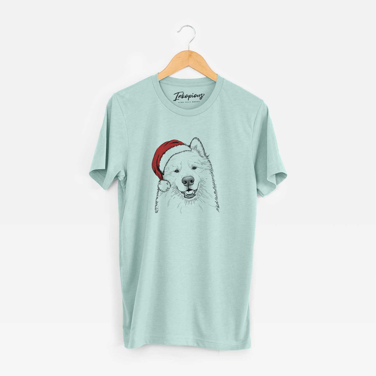 Hand-drawn sketch of Foster the Samoyed wearing a Santa hat on a Heather Sage Unisex crewneck