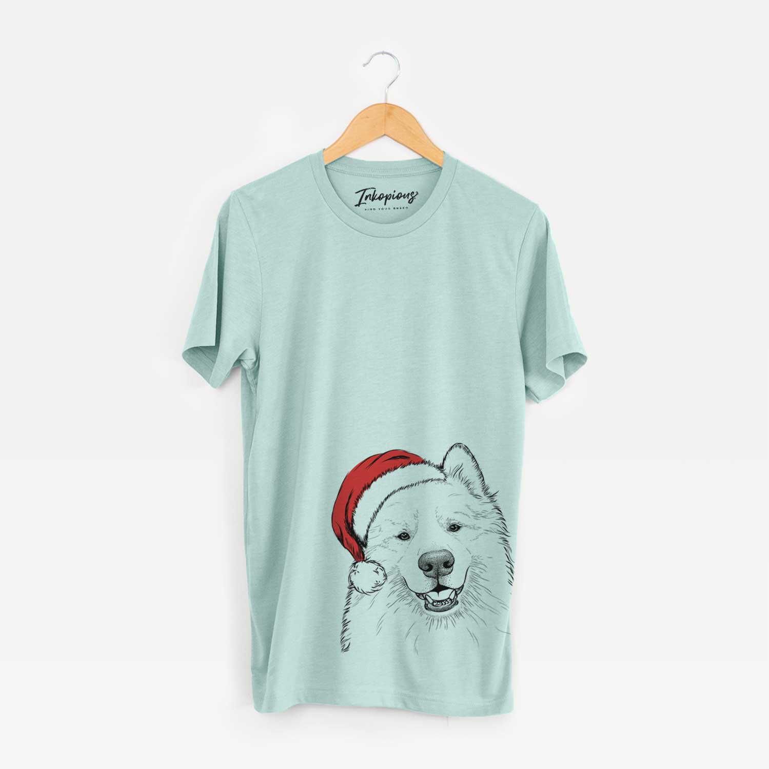 Hand-drawn sketch of Foster the Samoyed wearing a Santa hat on a Heather Sage Unisex crewneck