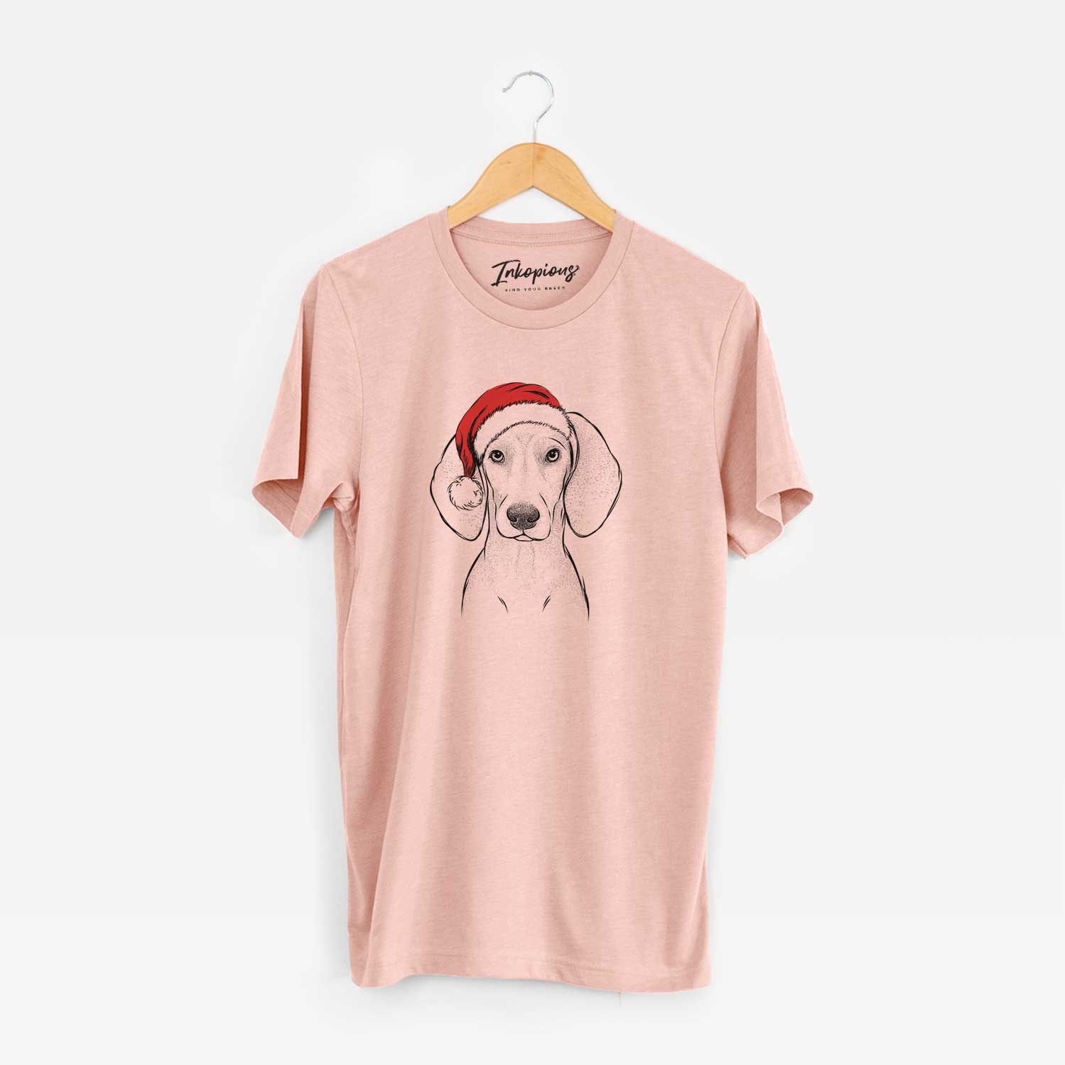 Hand-drawn sketch of Frejya the Weimaraner wearing a Santa hat on a Peach Unisex crewneck