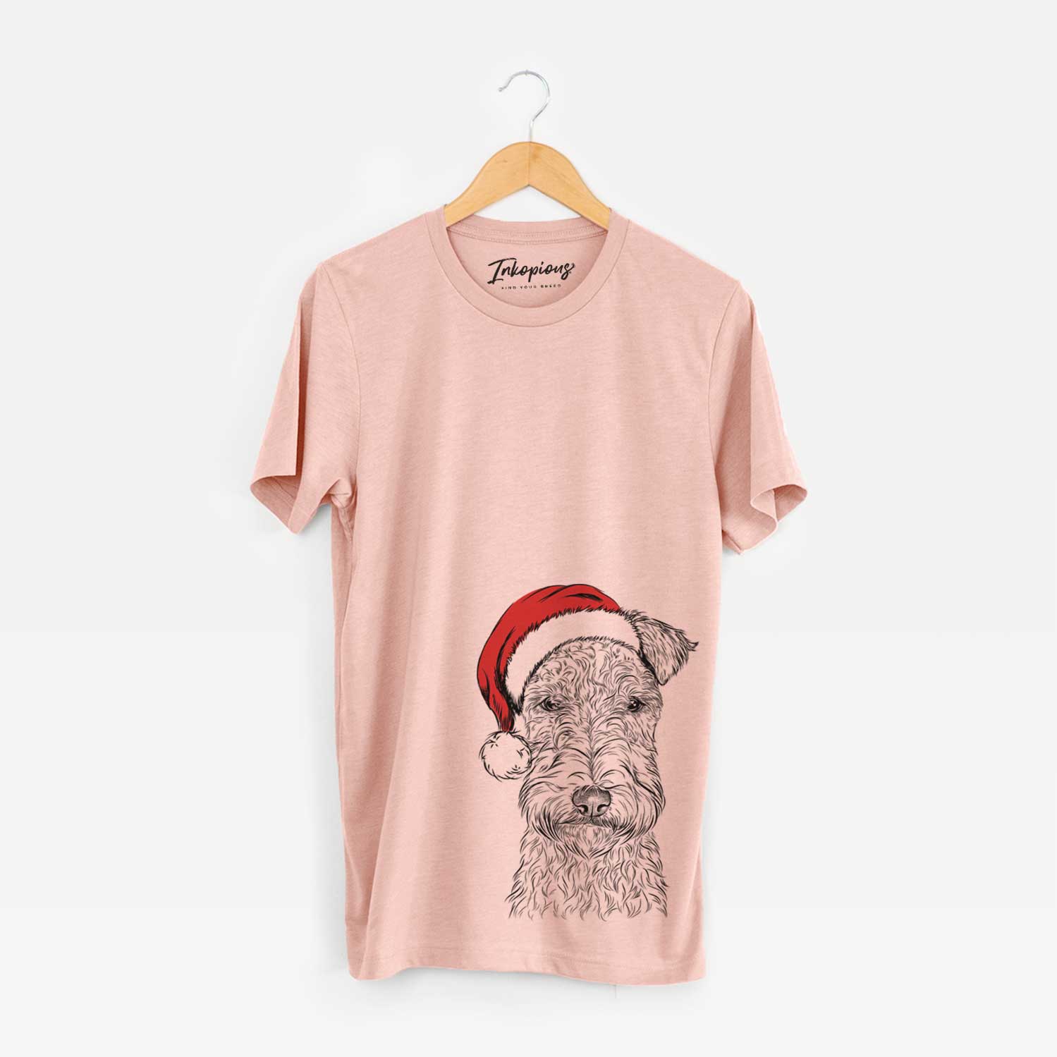 Hand-drawn sketch of Frida the Lakeland Terrier wearing a Santa hat on a Peach Unisex crewneck