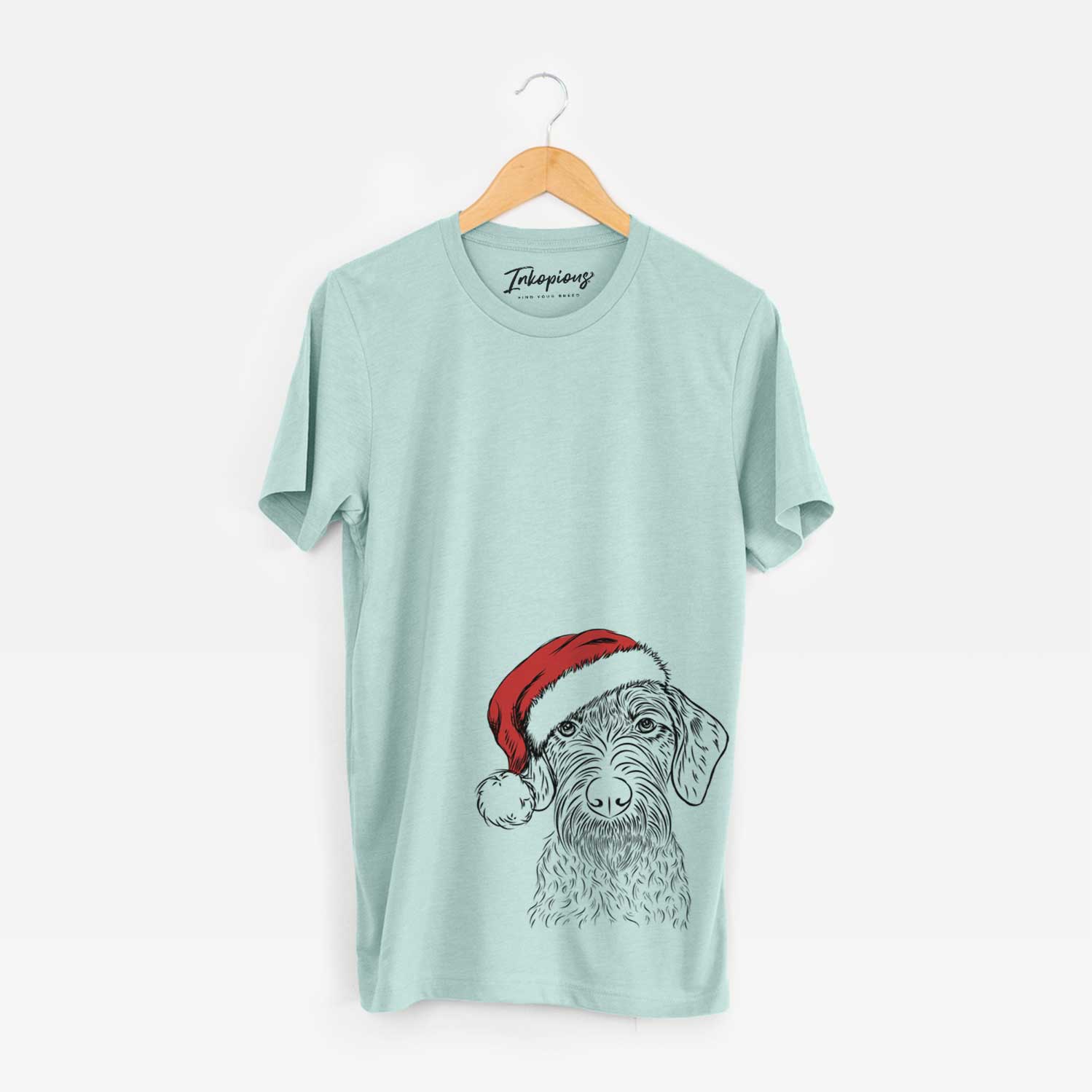 Hand-drawn sketch of Gus the German Wirehaired Pointer wearing a Santa hat on a Heather Sage Unisex crewneck