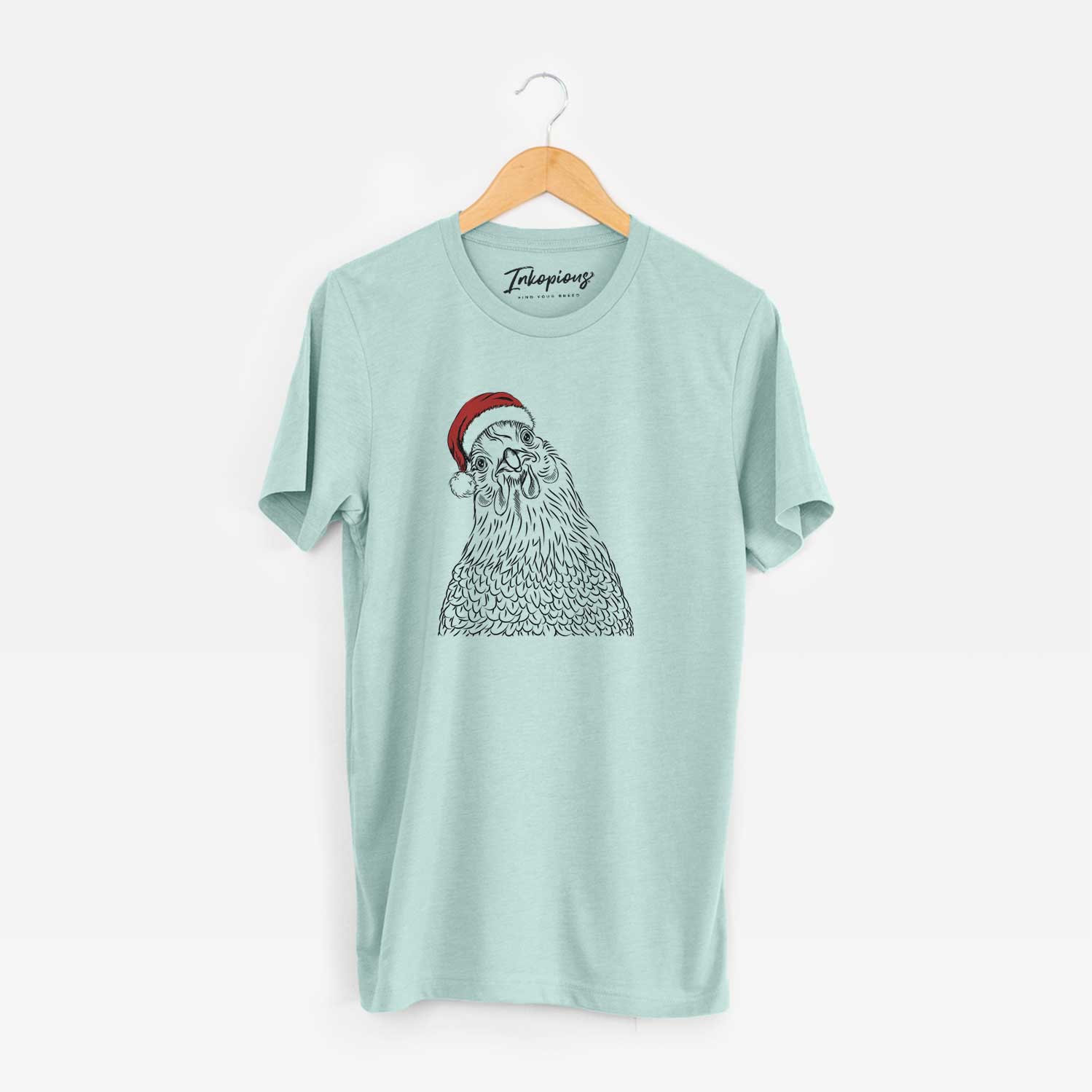 Hand-drawn sketch of Henrietta the Chicken wearing a Santa hat on a Heather Sage Unisex crewneck