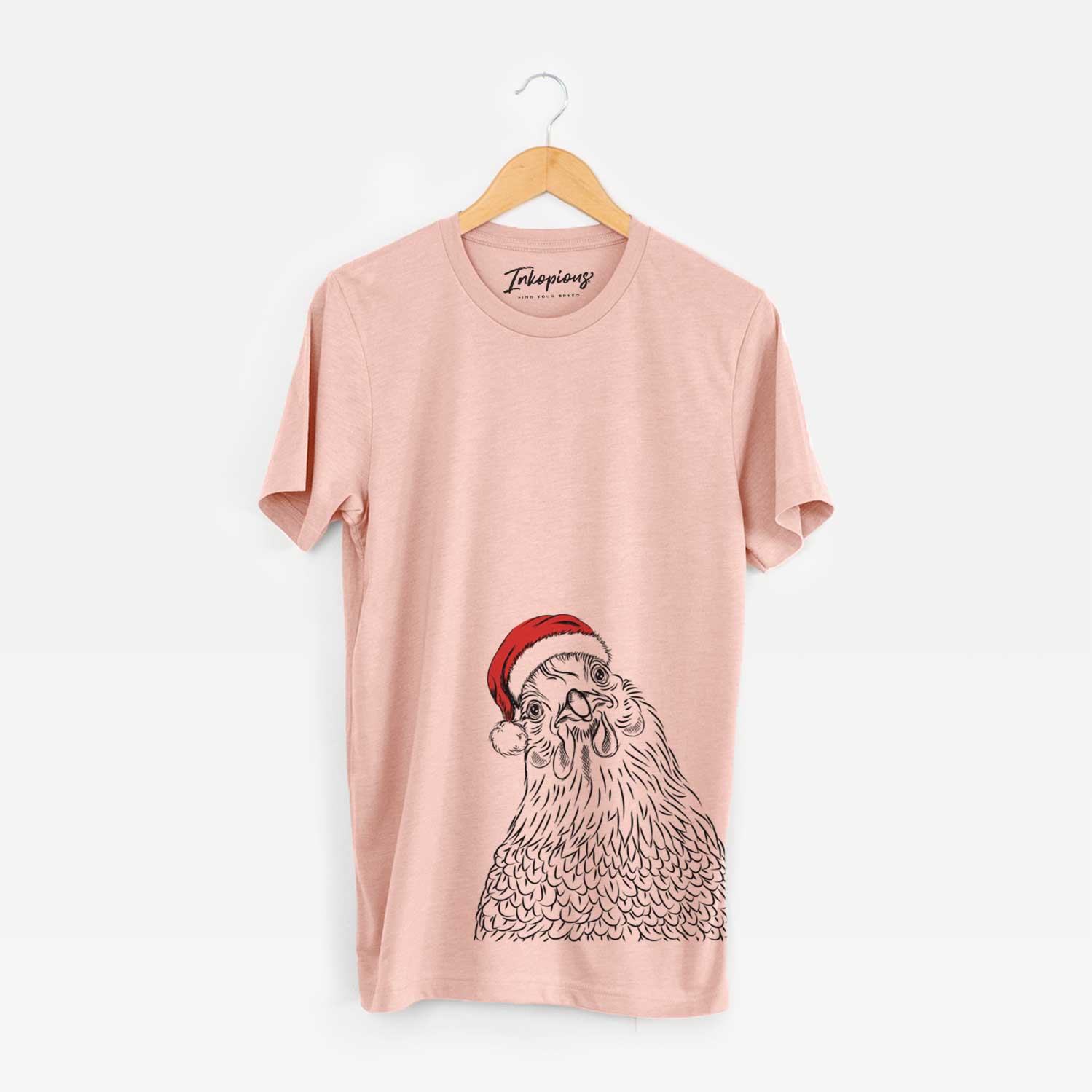 Hand-drawn sketch of Henrietta the Chicken wearing a Santa hat on a Peach Unisex crewneck