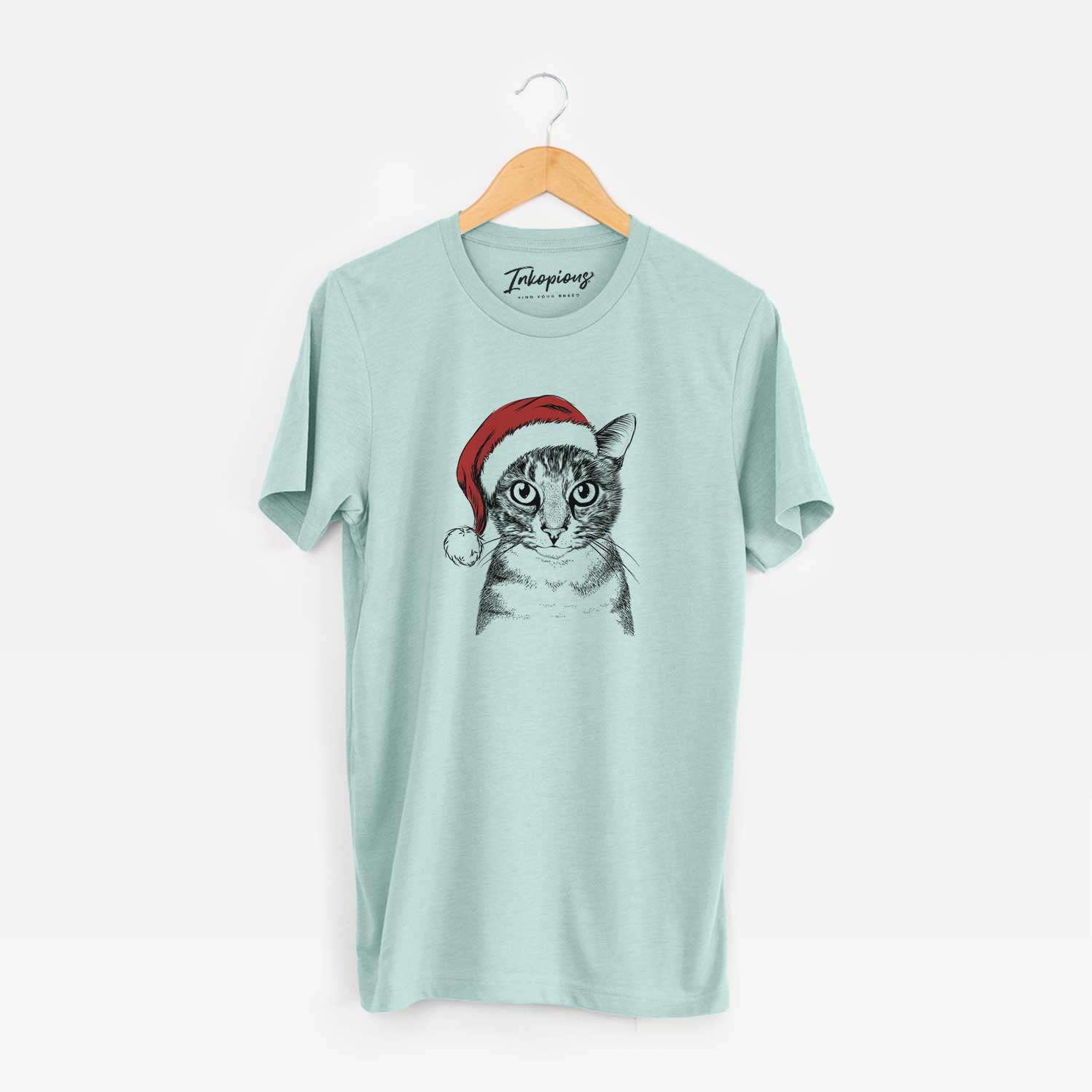 Hand-drawn sketch of Hobbes the Tabby Cat wearing a Santa hat on a Heather Sage Unisex crewneck
