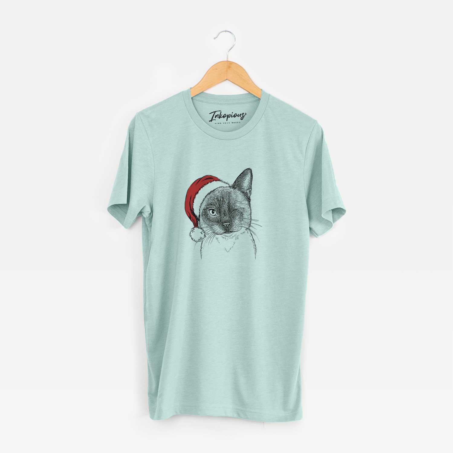 Hand-drawn sketch of Hoggle the Siamese Cat wearing a Santa hat on a Heather Sage Unisex crewneck