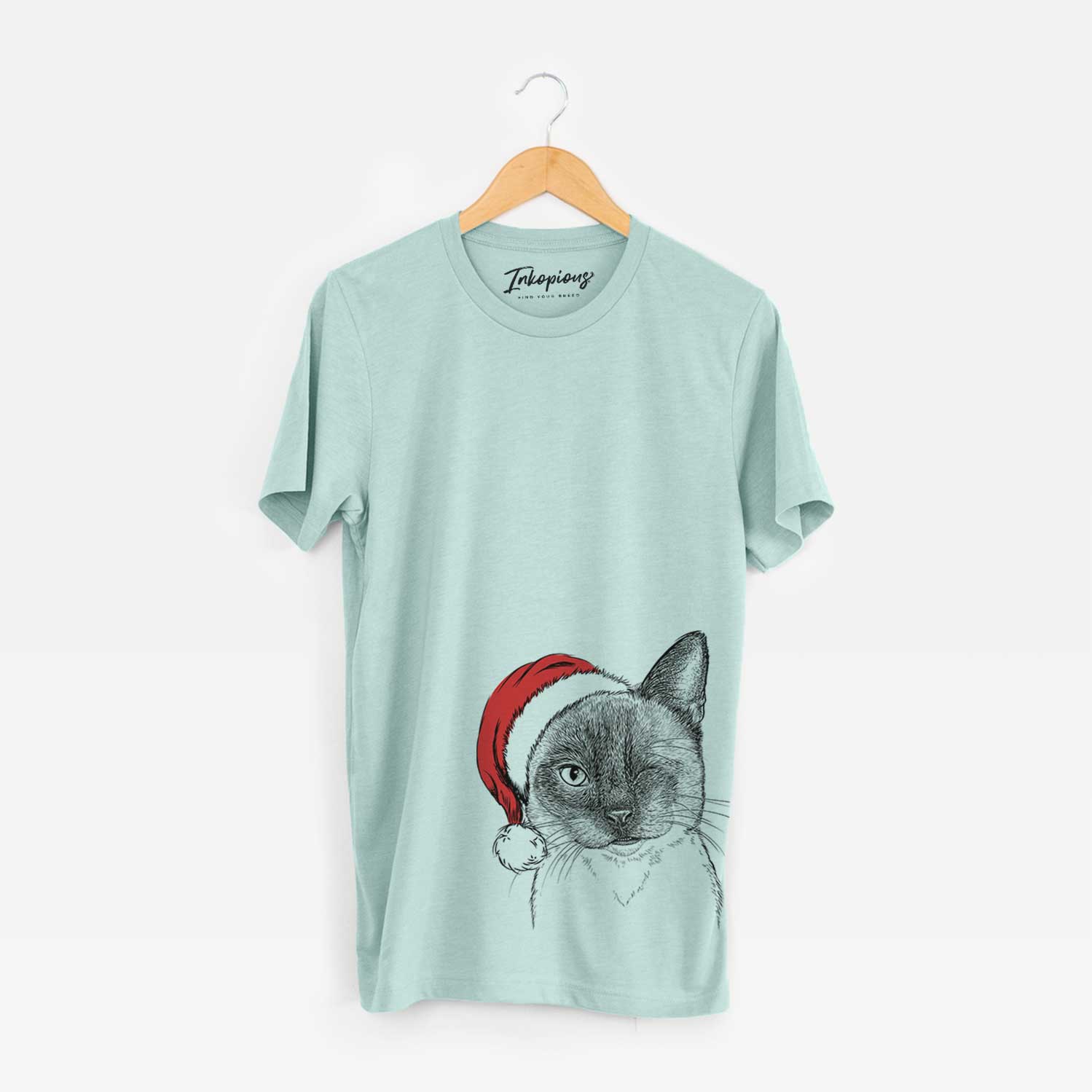 Hand-drawn sketch of Hoggle the Siamese Cat wearing a Santa hat on a Heather Sage Unisex crewneck