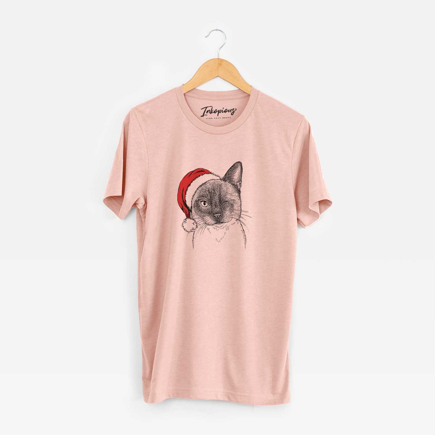 Hand-drawn sketch of Hoggle the Siamese Cat wearing a Santa hat on a Peach Unisex crewneck