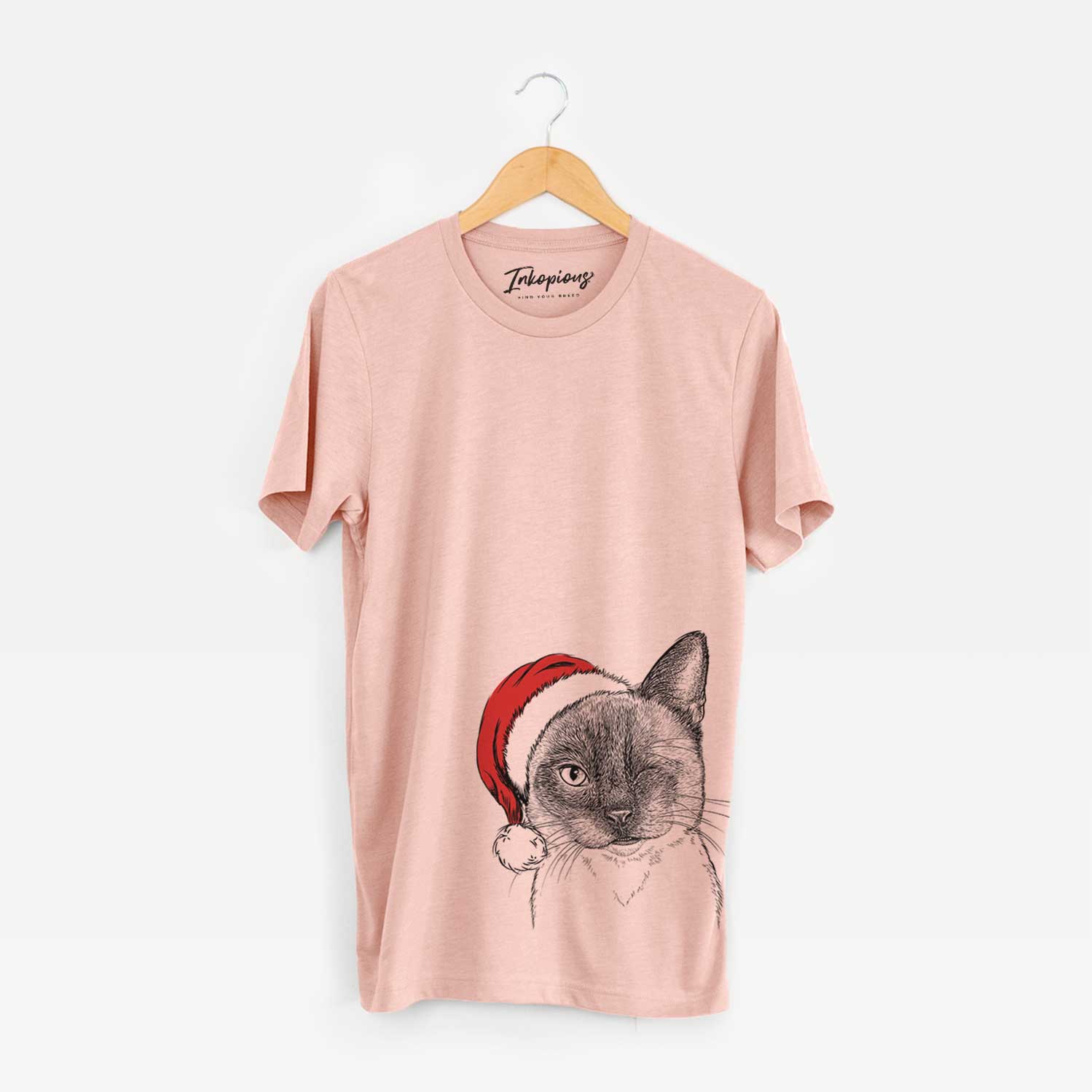 Hand-drawn sketch of Hoggle the Siamese Cat wearing a Santa hat on a Peach Unisex crewneck