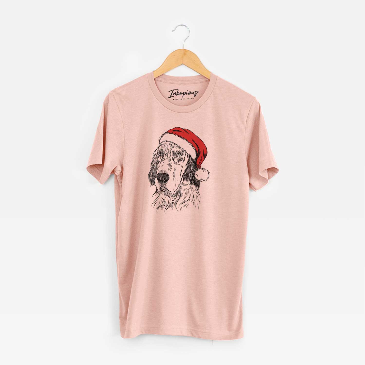 Hand-drawn sketch of Hutch the English Setter wearing a Santa hat on a Peach Unisex crewneck