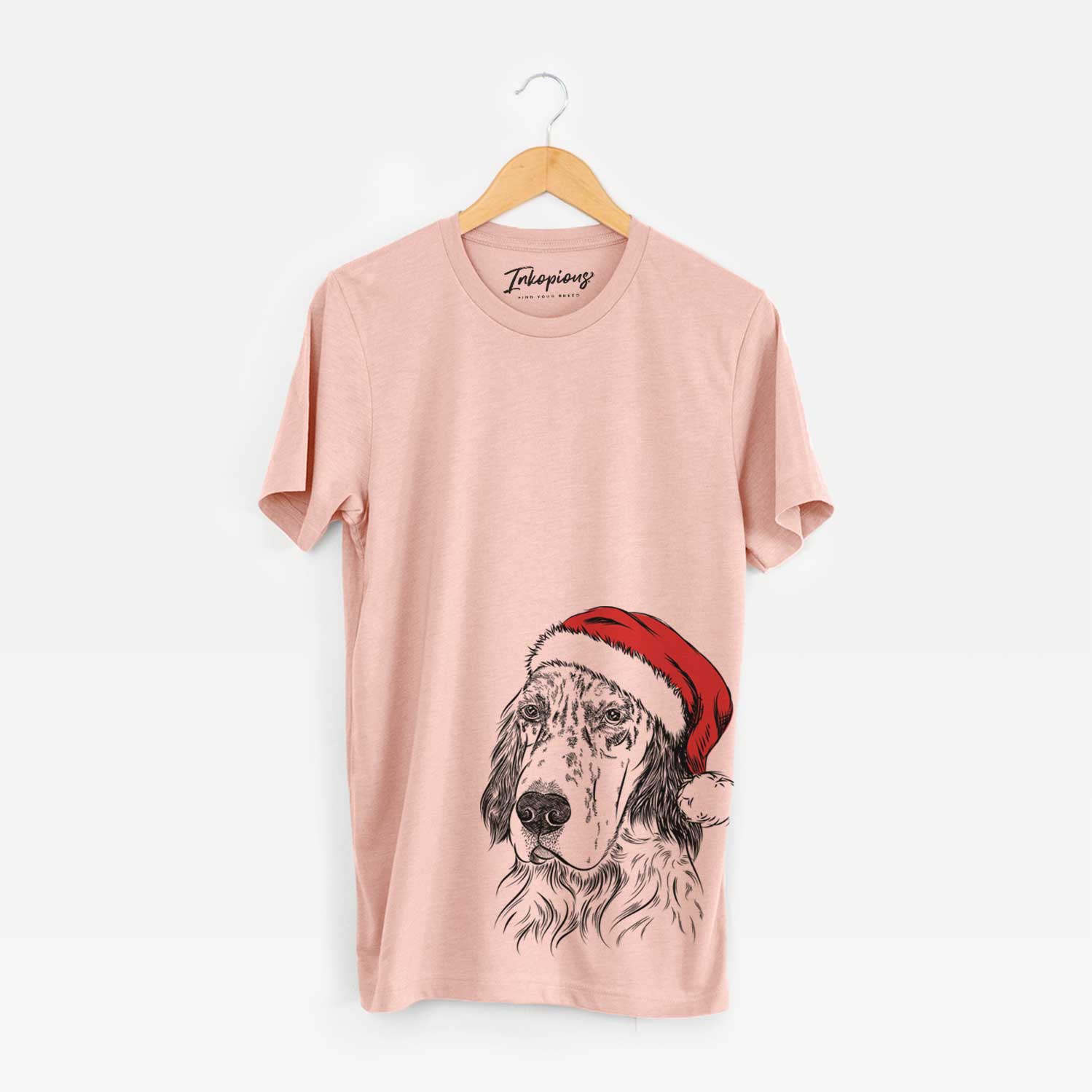 Hand-drawn sketch of Hutch the English Setter wearing a Santa hat on a Peach Unisex crewneck