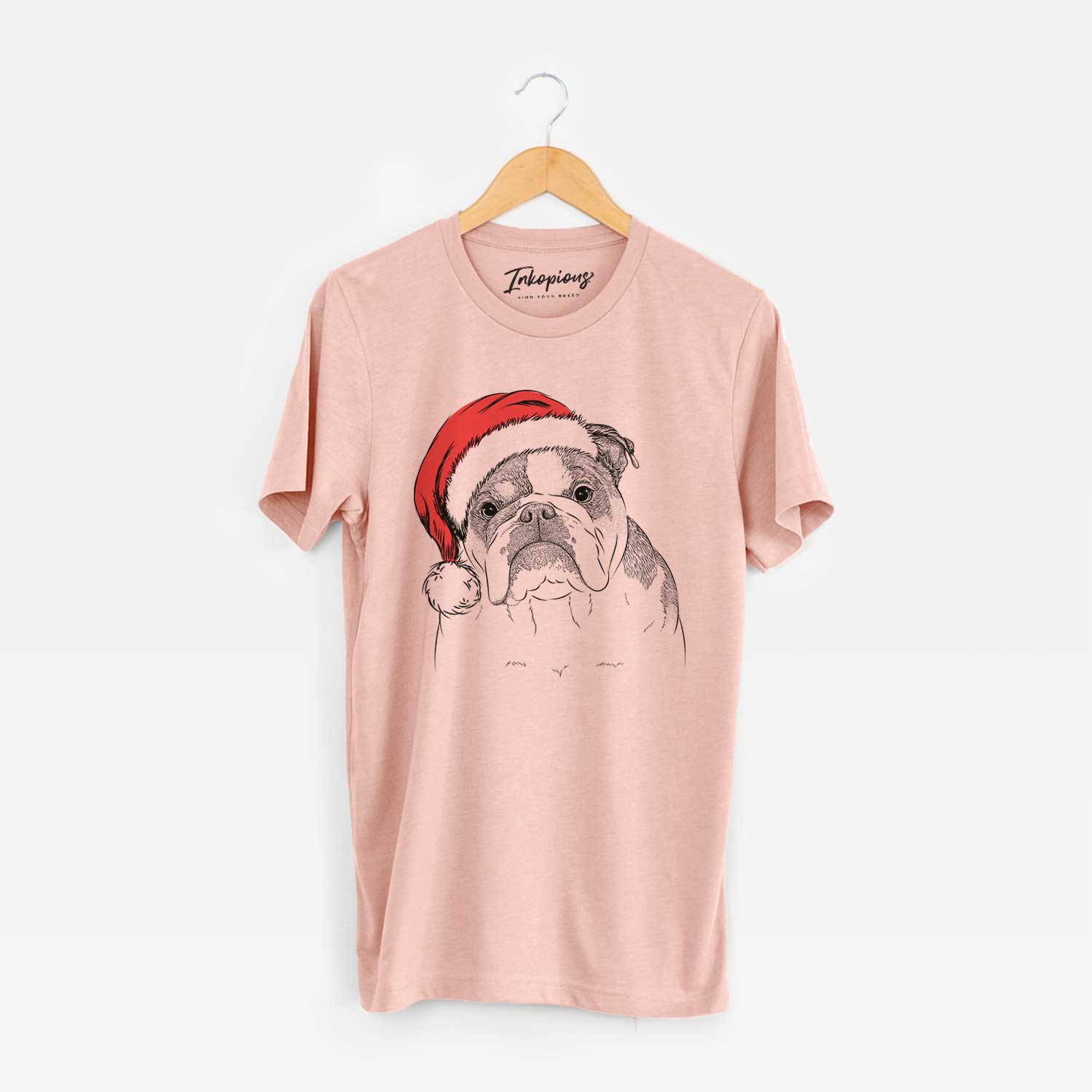 Hand-drawn sketch of Jack the English Bulldog wearing a Santa hat on a Peach Unisex crewneck