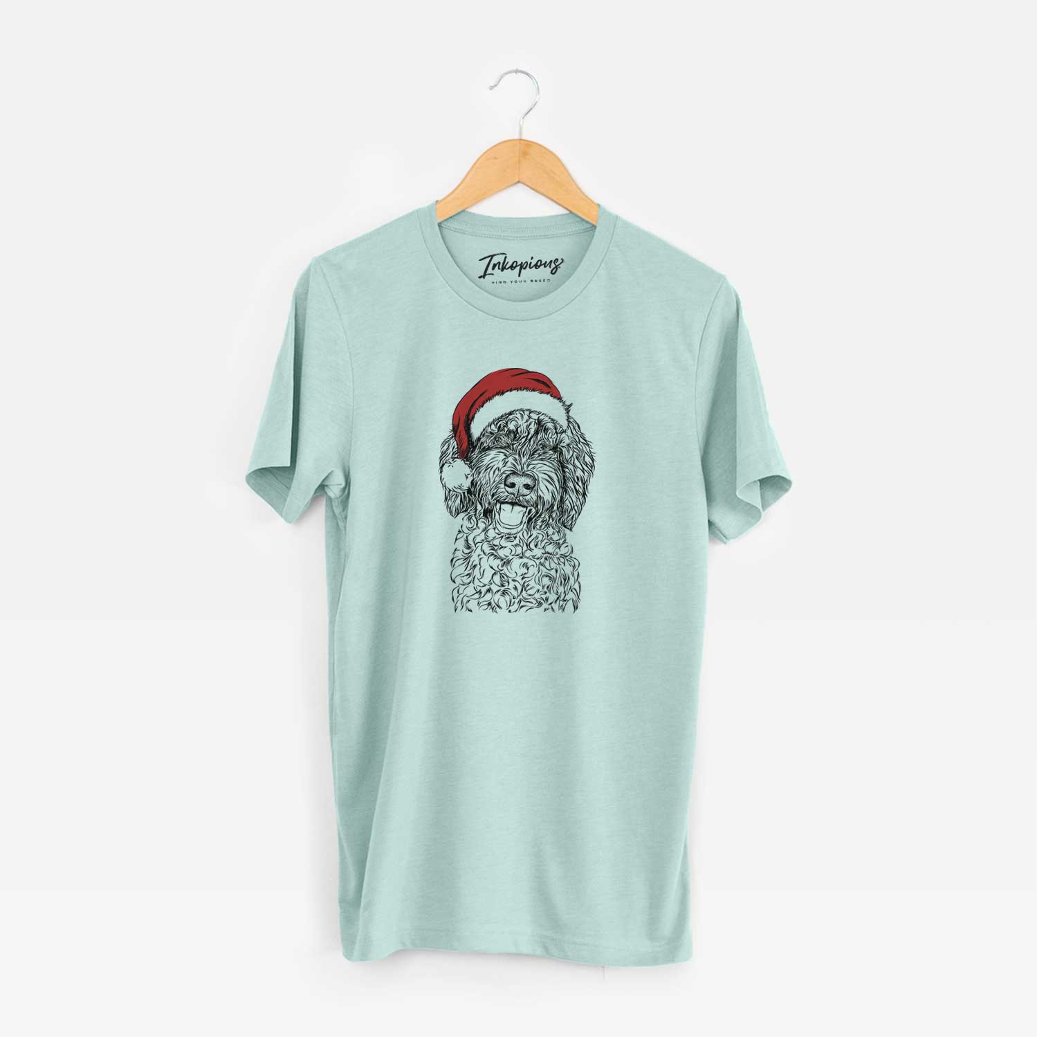 Hand-drawn sketch of Jack the Chocolate Labradoodle wearing a Santa hat on a Heather Sage Unisex crewneck