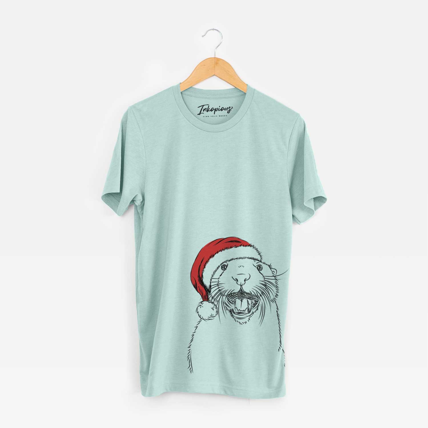 Hand-drawn sketch of Jasper the River Otter wearing a Santa hat on a Heather Sage Unisex crewneck