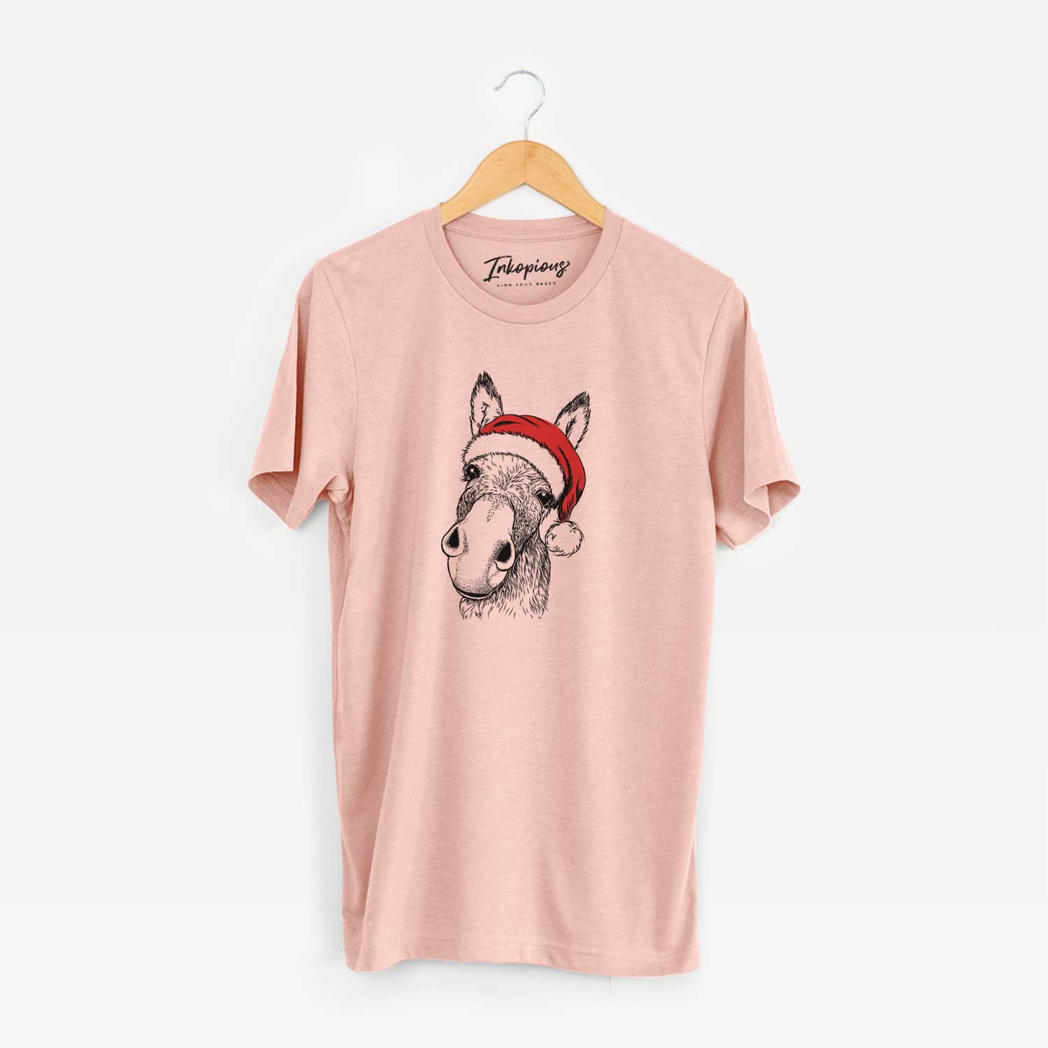 Hand-drawn sketch of Jenny the Donkey wearing a Santa hat on a Peach Unisex crewneck