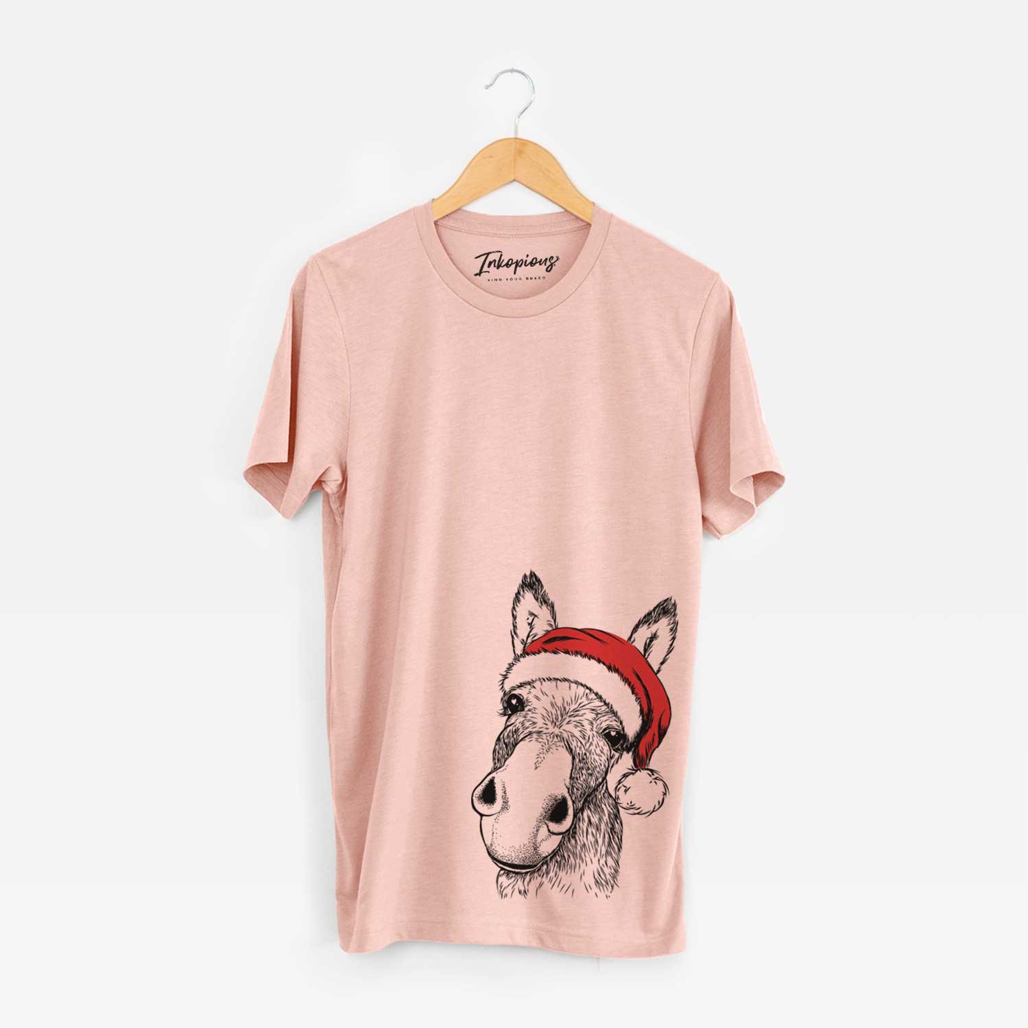 Hand-drawn sketch of Jenny the Donkey wearing a Santa hat on a Peach Unisex crewneck
