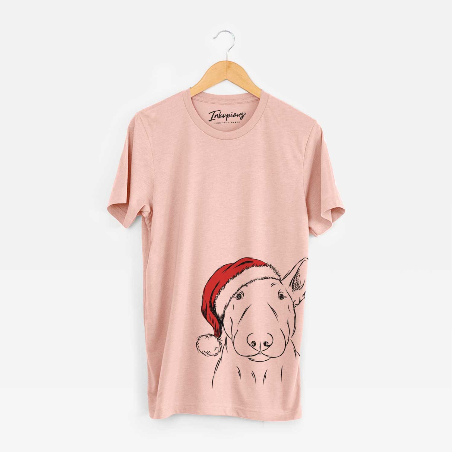 Hand-drawn sketch of Jett the Bull Terrier wearing a Santa hat on a Peach Unisex crewneck