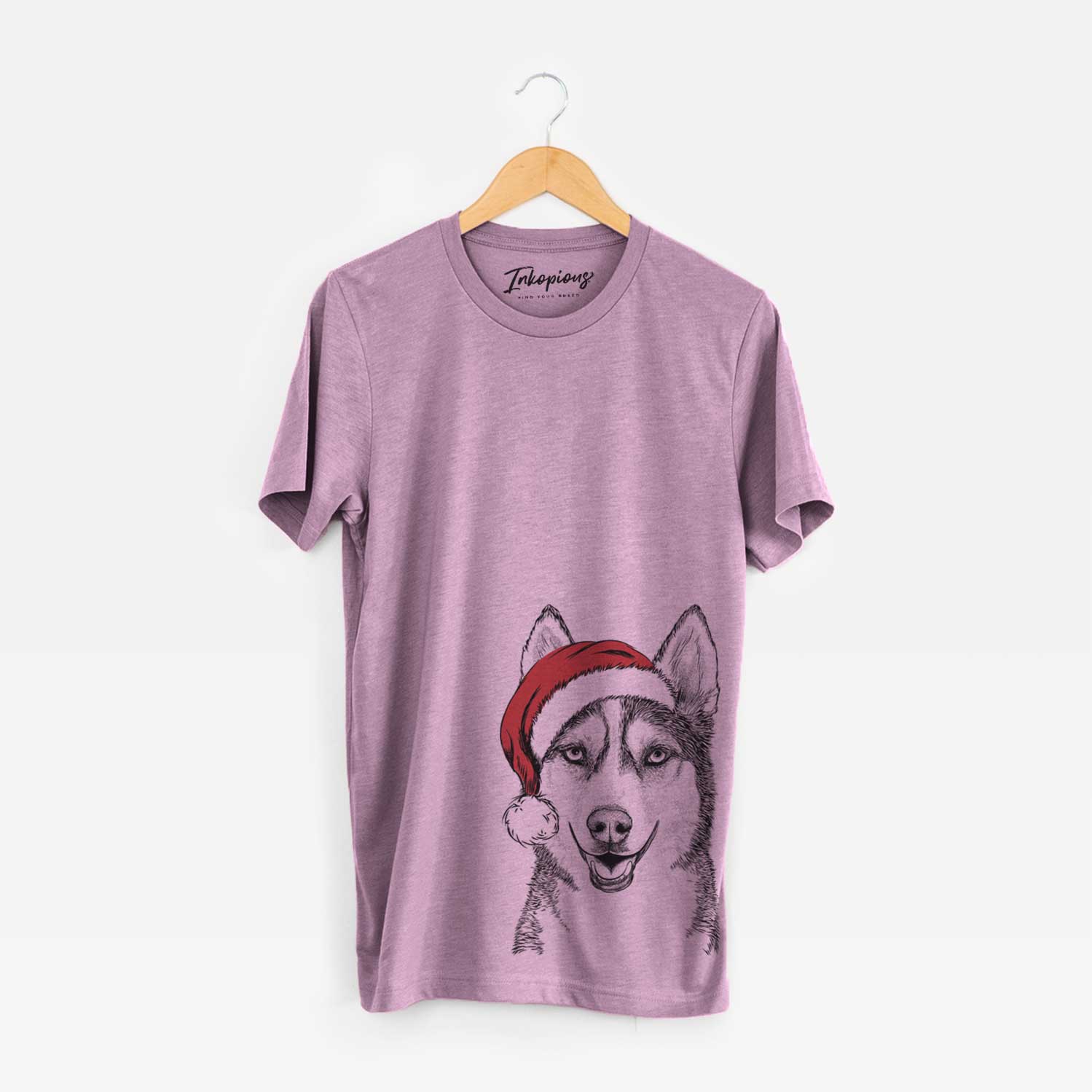 Hand-drawn sketch of Kira the Siberian Husky wearing a Santa hat on an Orchid Unisex crewneck