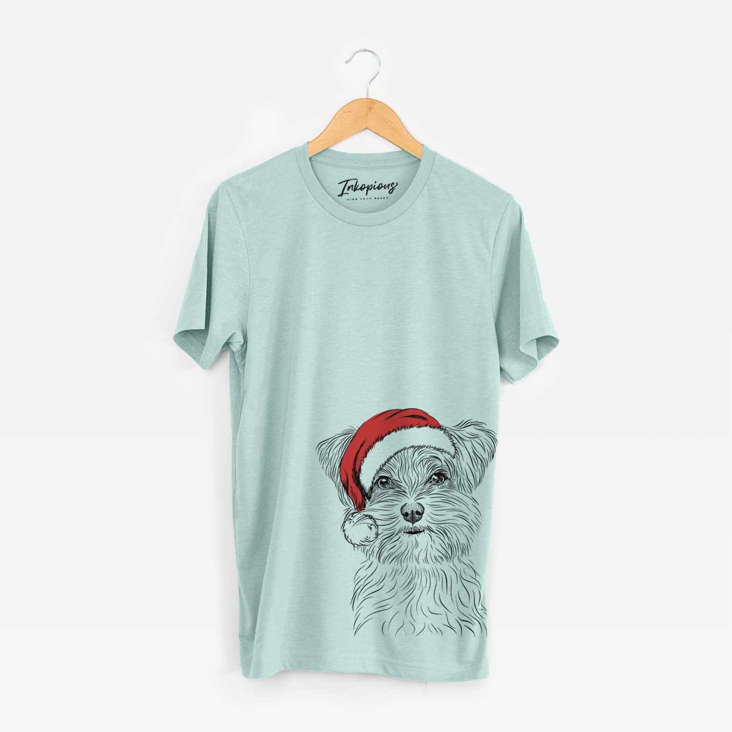 Hand-drawn sketch of Kiwi the Morkie wearing a Santa hat on a Heather Sage Unisex crewneck