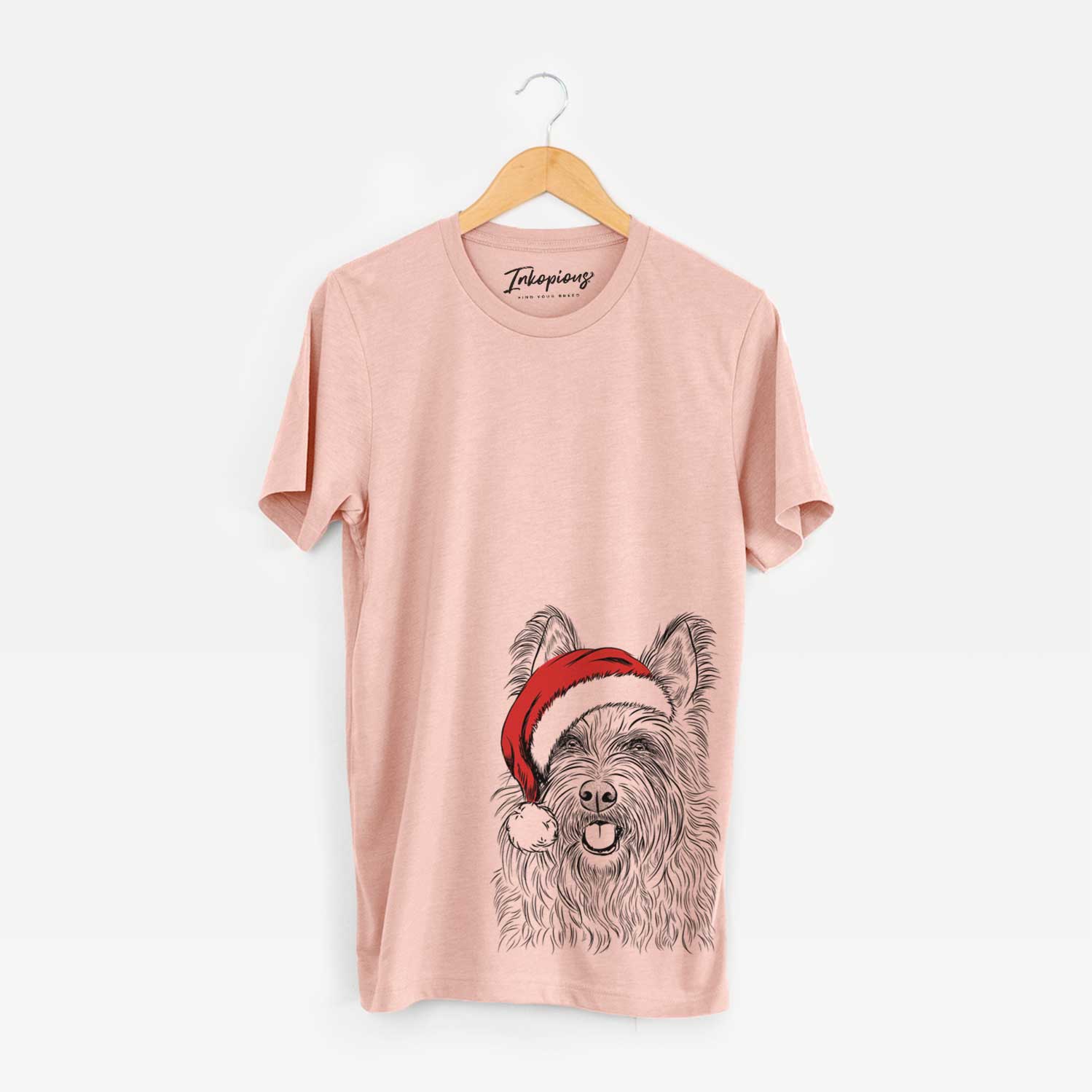 Hand-drawn sketch of Kyros the Berger Picard wearing a Santa hat on a Peach Unisex crewneck