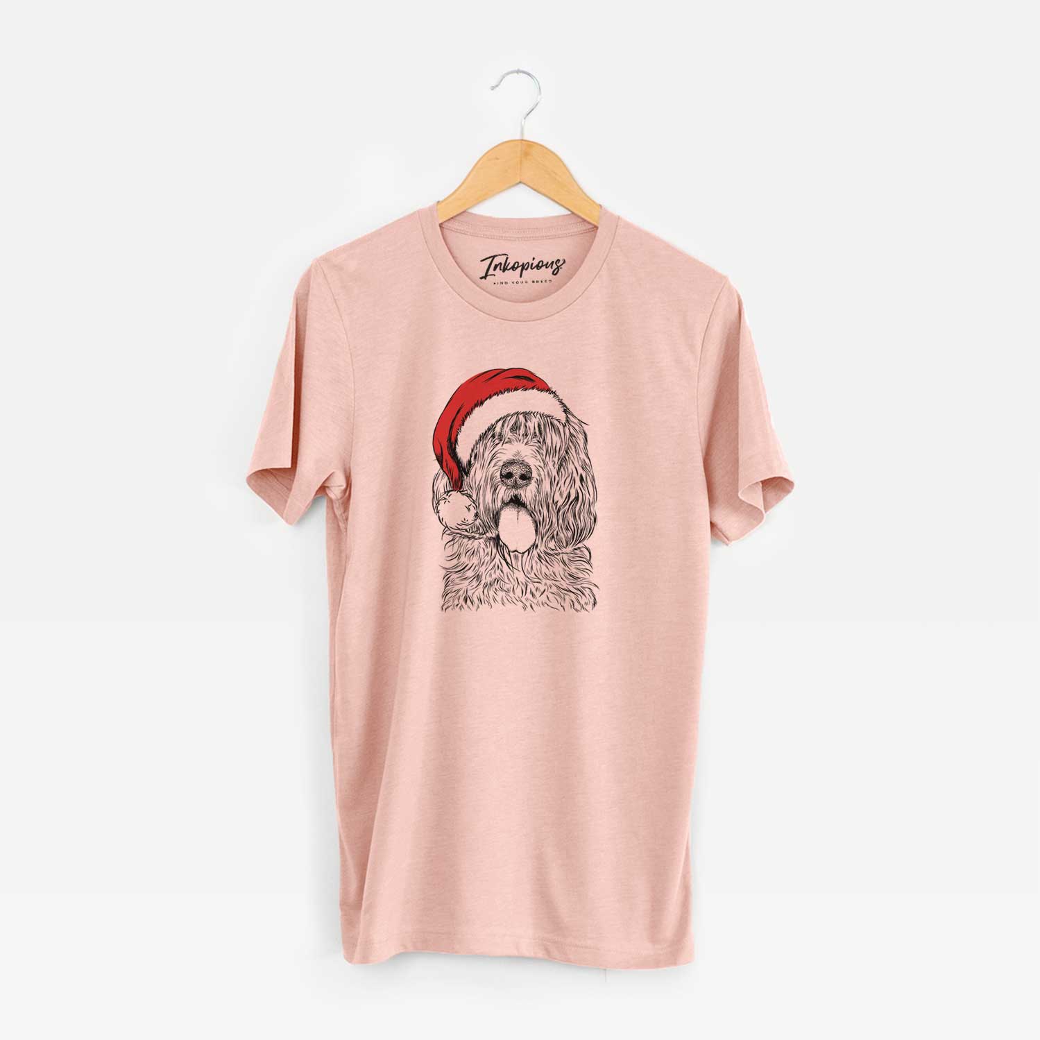Hand-drawn sketch of Lou the Otterhound wearing a Santa hat on a Peach Unisex crewneck