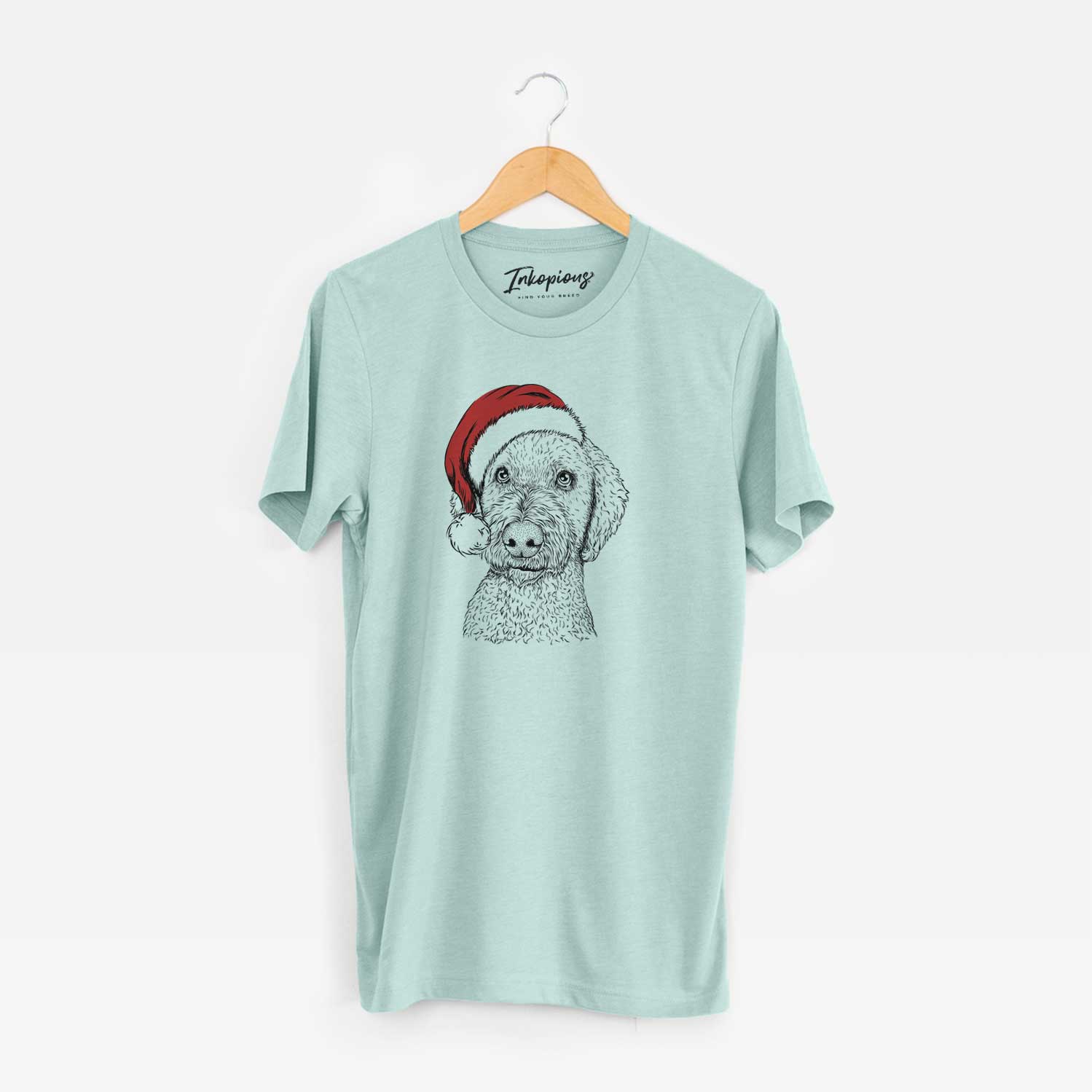 Hand-drawn sketch of Lucy Boo the Goldendoodle wearing a Santa hat on a Heather Sage Unisex crewneck