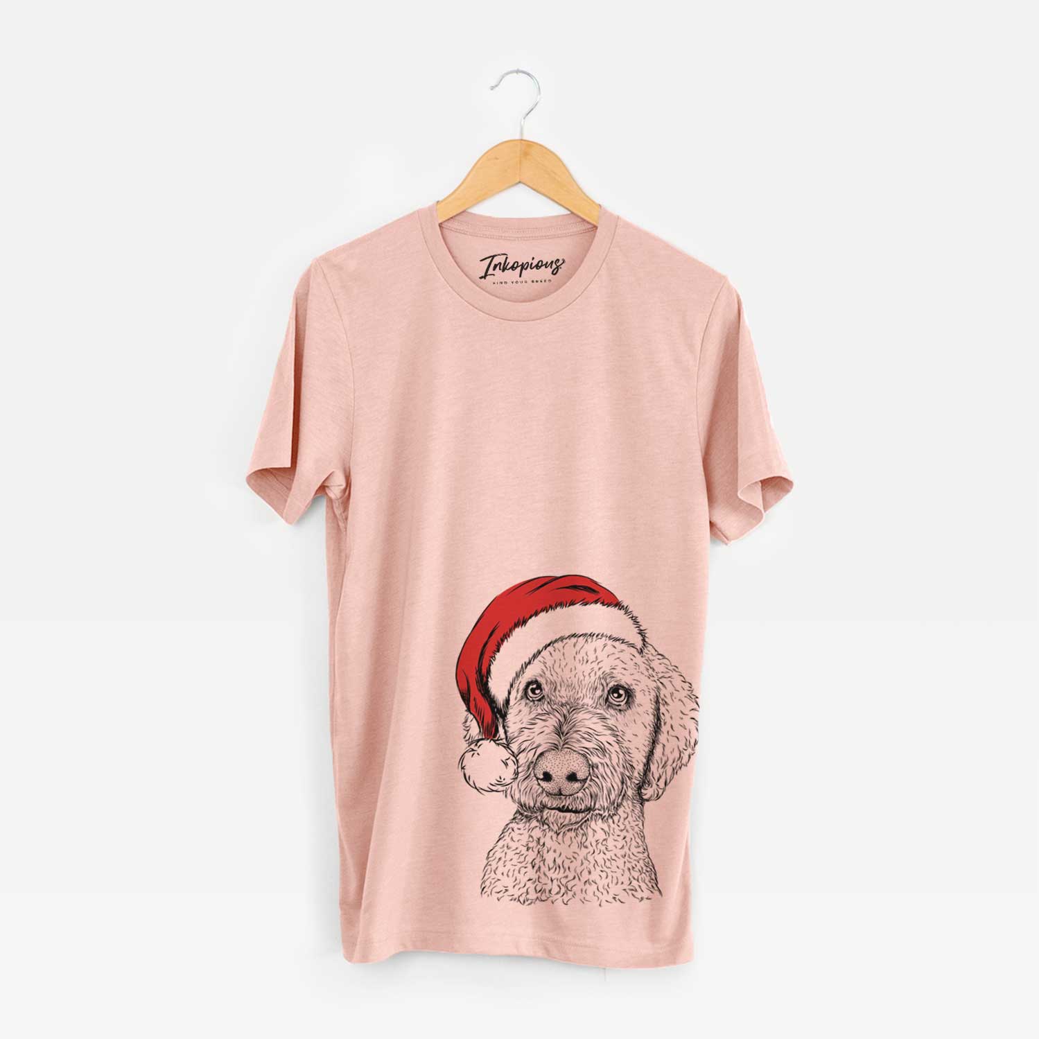 Hand-drawn sketch of Lucy Boo the Goldendoodle wearing a Santa hat on a Peach Unisex crewneck