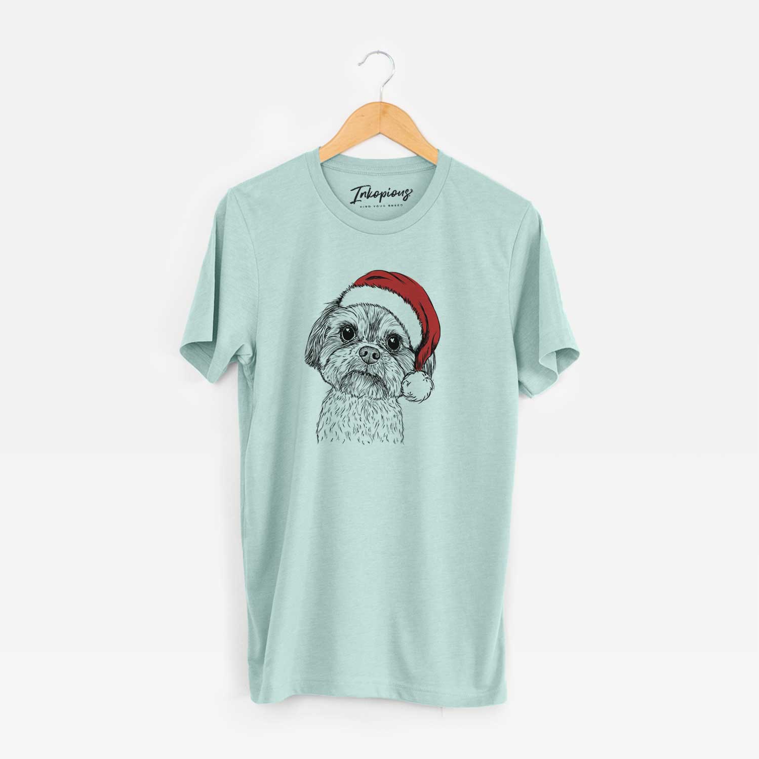 Hand-drawn sketch of Lucy the Shorkie wearing a Santa hat on a Heather Sage Unisex crewneck