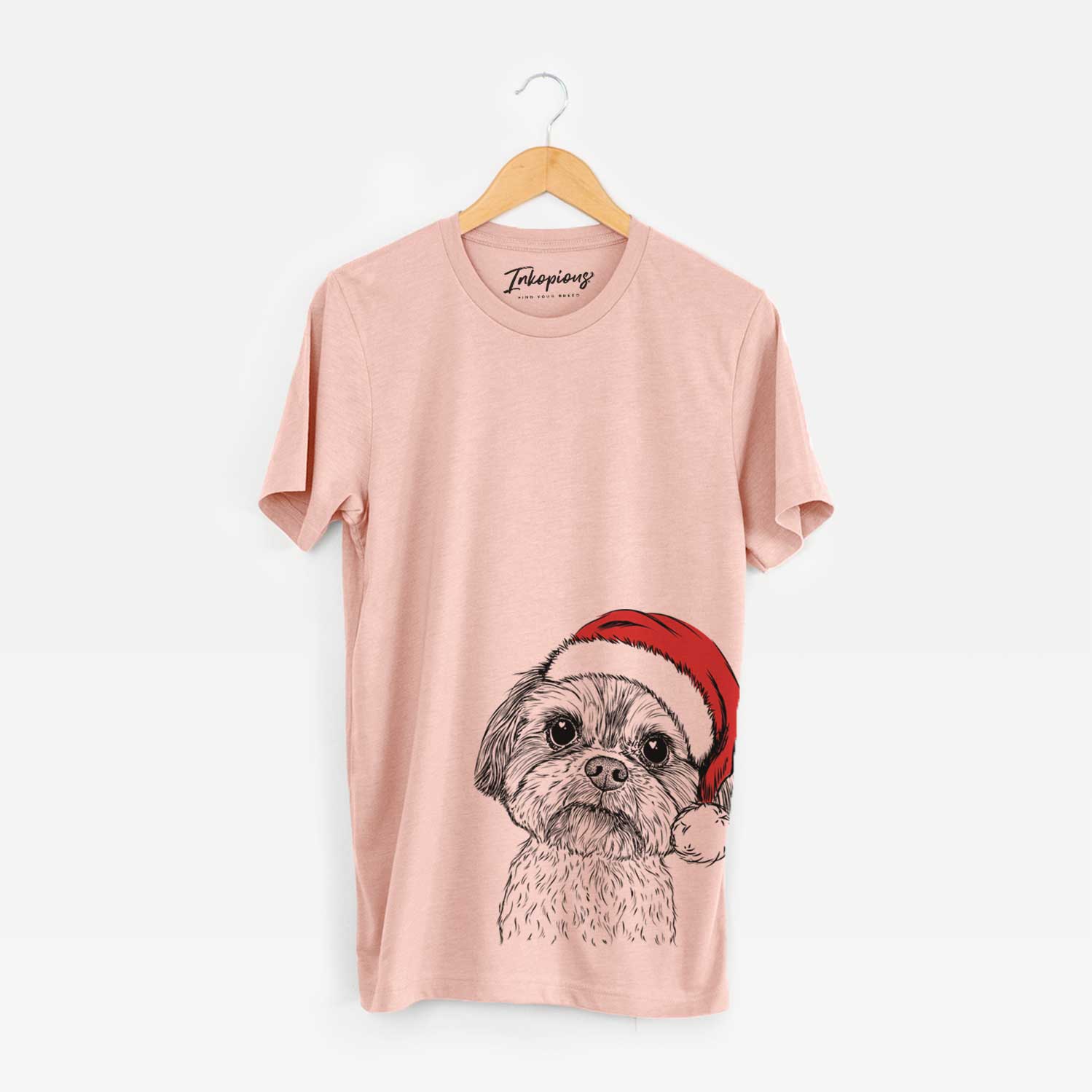Hand-drawn sketch of Lucy the Shorkie wearing a Santa hat on a Peach Unisex crewneck