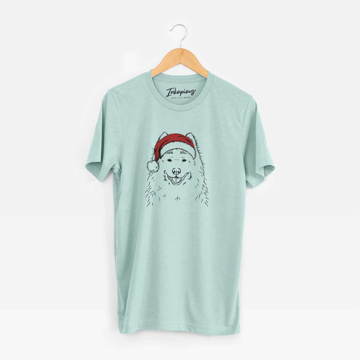 Hand-drawn sketch of Luka the Samoyed wearing a Santa hat on a Heather Sage Unisex crewneck