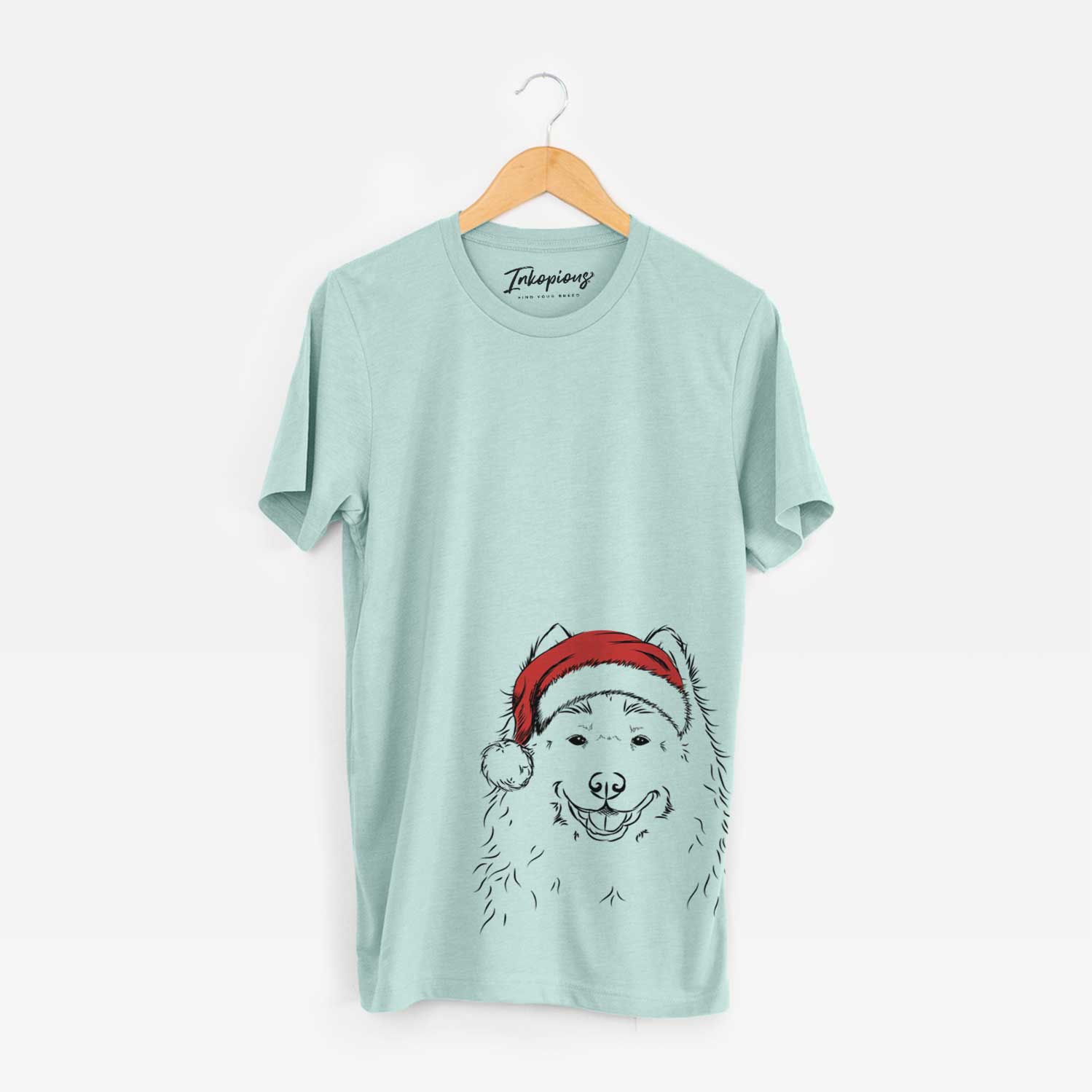 Hand-drawn sketch of Luka the Samoyed wearing a Santa hat on a Heather Sage Unisex crewneck