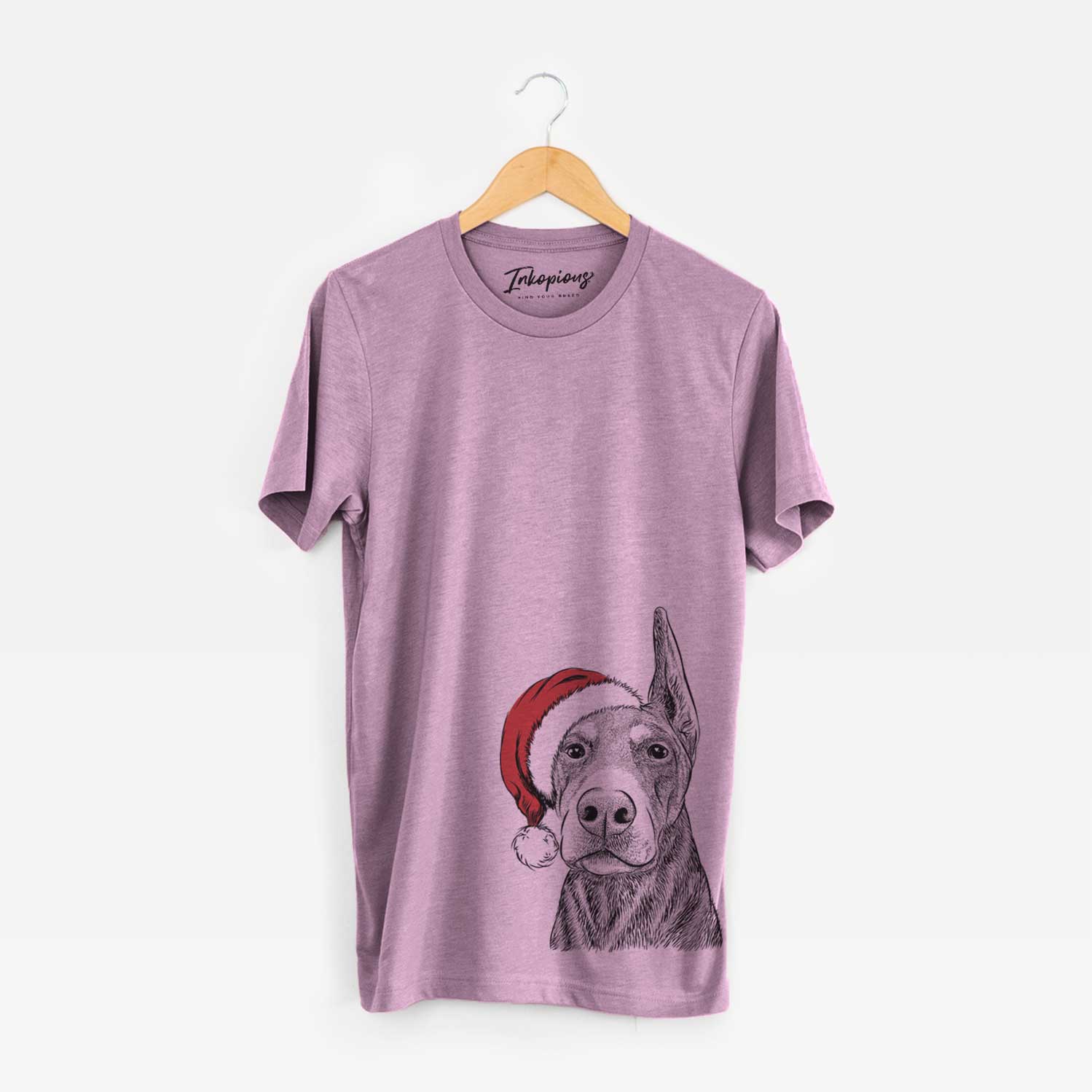 Hand-drawn sketch of Luna the Doberman Pinscher wearing a Santa hat on an Orchid Unisex crewneck