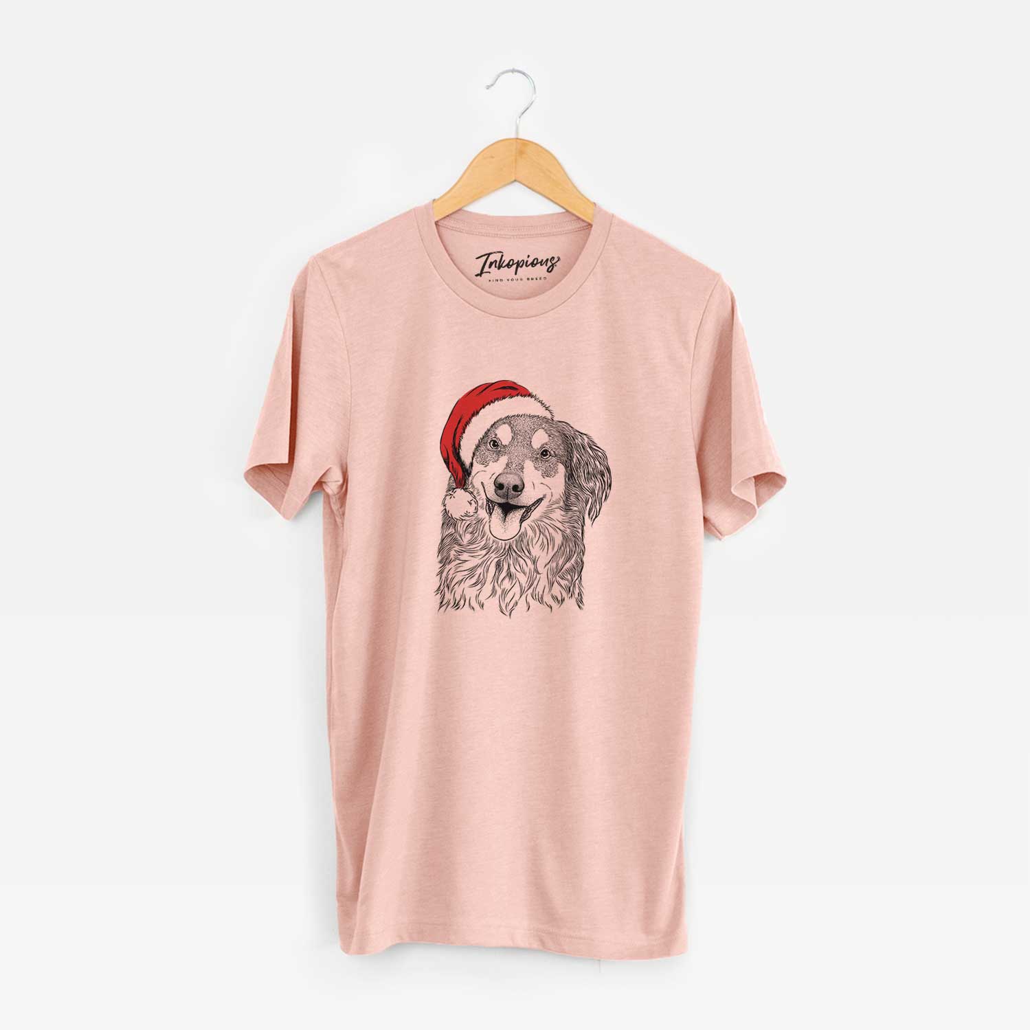 Hand-drawn sketch of Maddie the English Shepherd wearing a Santa hat on a Peach Unisex crewneck