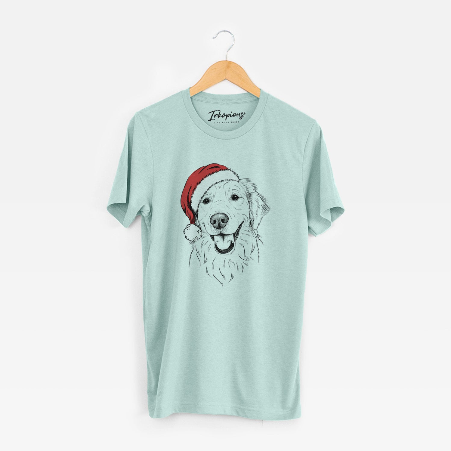 Hand-drawn sketch of Maple the Golden Retriever wearing a Santa hat on a Heather Sage Unisex crewneck