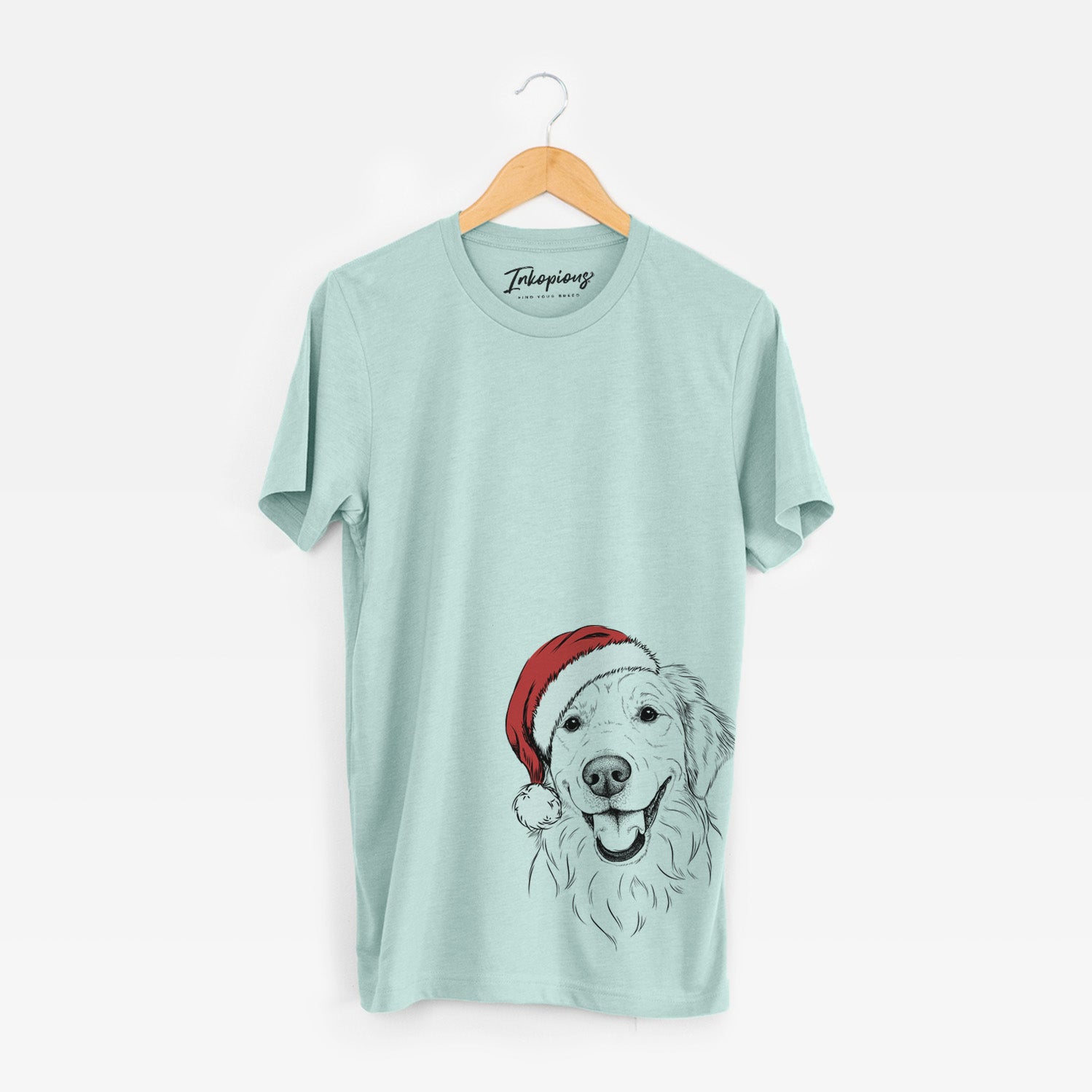 Hand-drawn sketch of Maple the Golden Retriever wearing a Santa hat on a Heather Sage Unisex crewneck