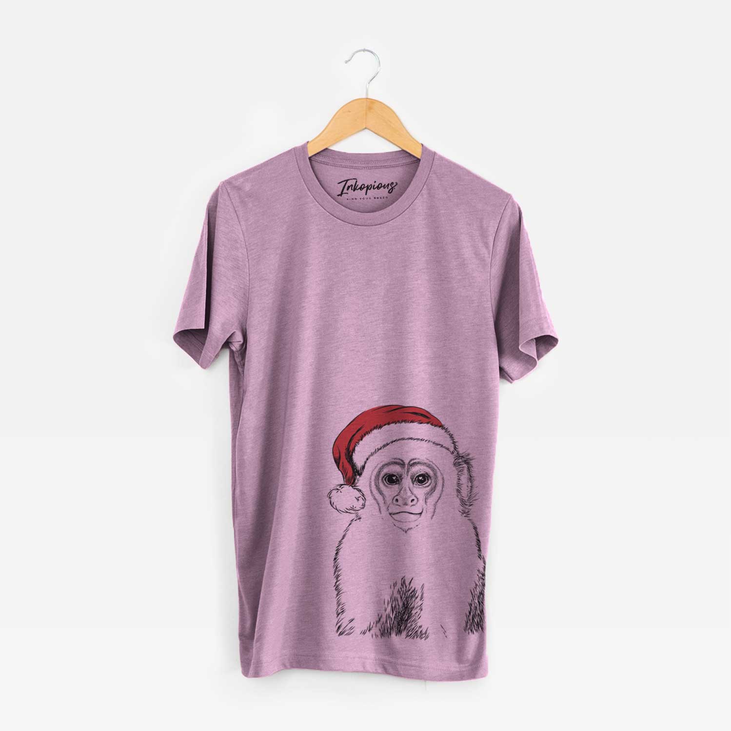 Hand-drawn sketch of Marcel the Capuchin Monkey wearing a Santa hat on an Orchid Unisex crewneck