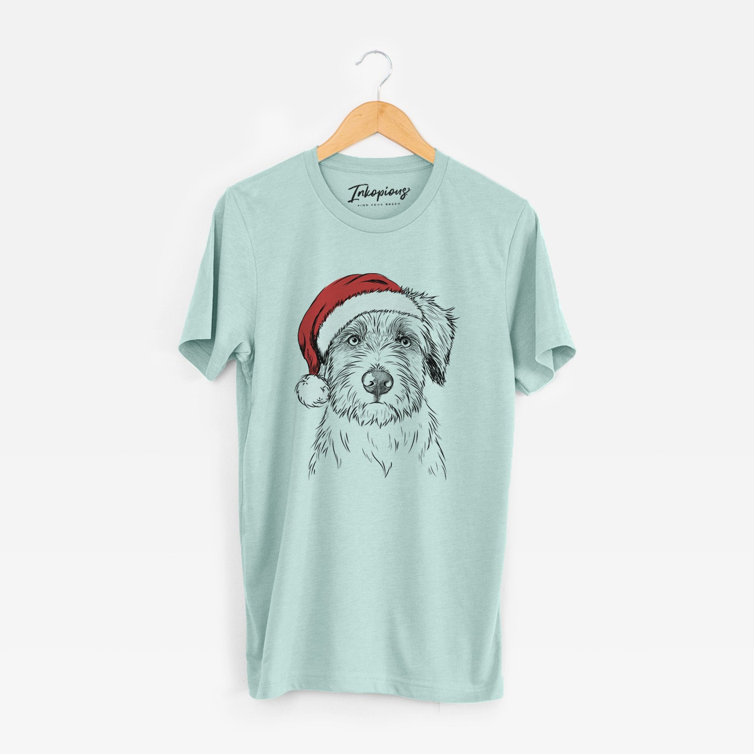 Hand-drawn sketch of Marek the Bernedoodle wearing a Santa hat on a Heather Sage Unisex crewneck