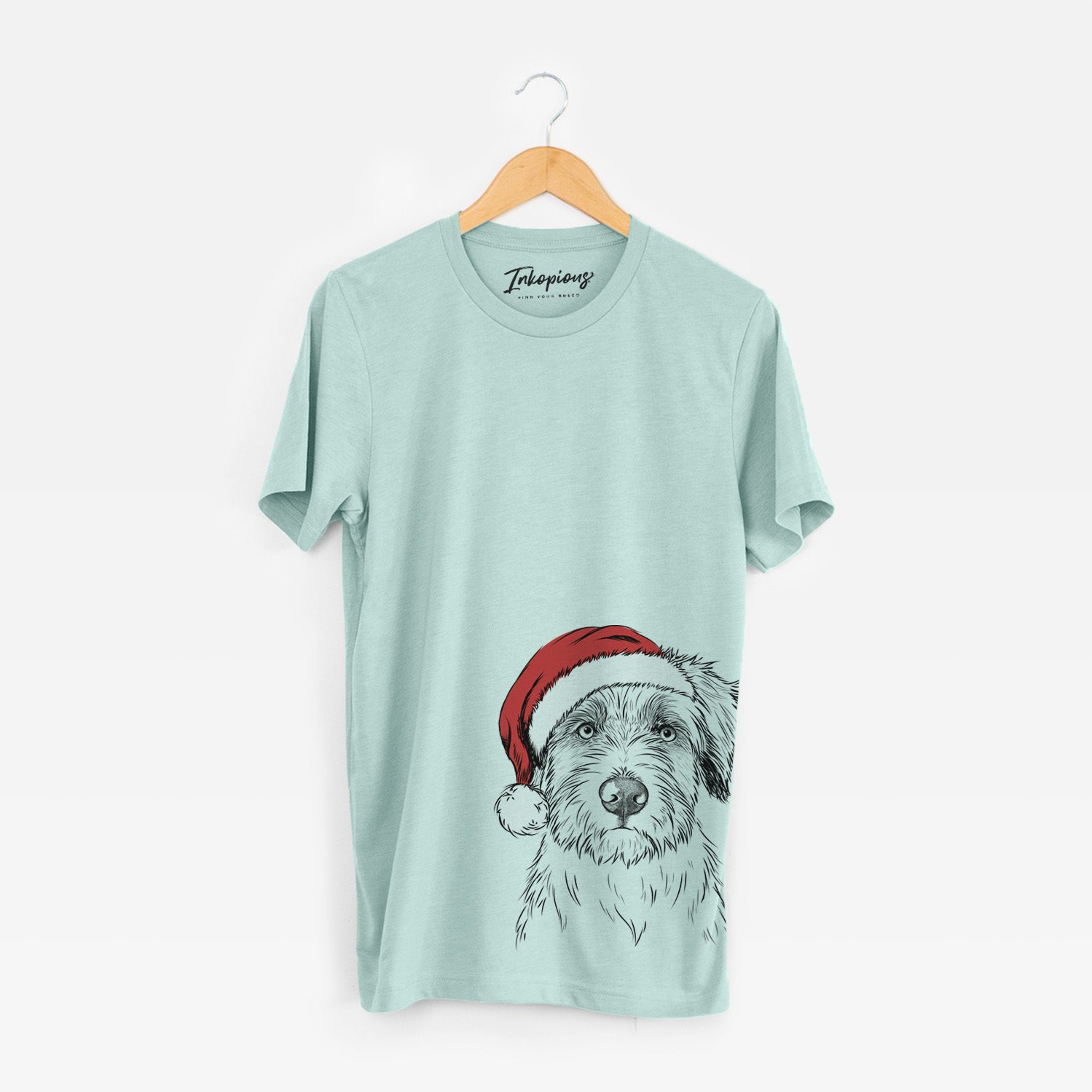 Hand-drawn sketch of Marek the Bernedoodle wearing a Santa hat on a Heather Sage Unisex crewneck