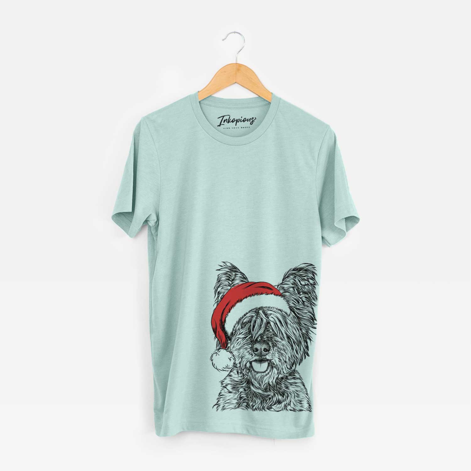 Hand-drawn sketch of McDuff the Cairn Terrier wearing a Santa hat on a Heather Sage Unisex crewneck
