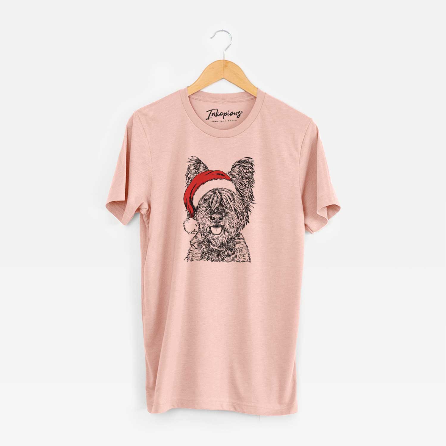 Hand-drawn sketch of McDuff the Cairn Terrier wearing a Santa hat on a Peach Unisex crewneck
