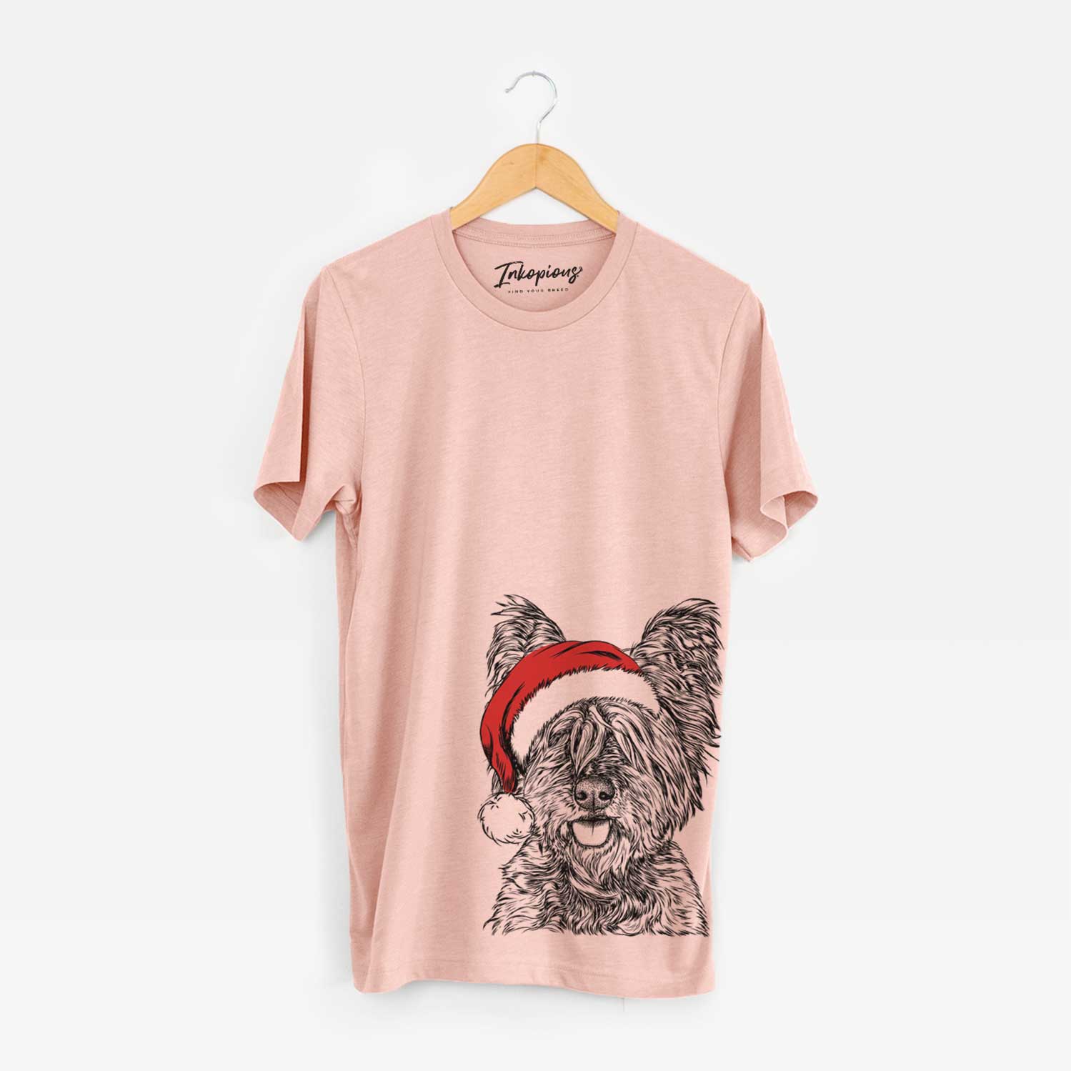 Hand-drawn sketch of McDuff the Cairn Terrier wearing a Santa hat on a Peach Unisex crewneck