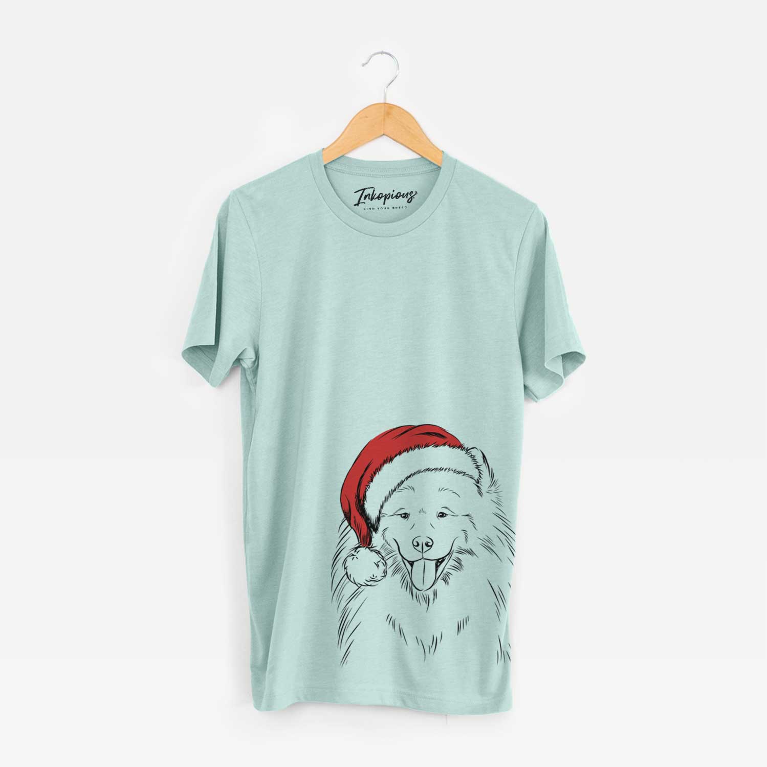 Hand-drawn sketch of Mikko the Samoyed wearing a Santa hat on a Heather Sage Unisex crewneck
