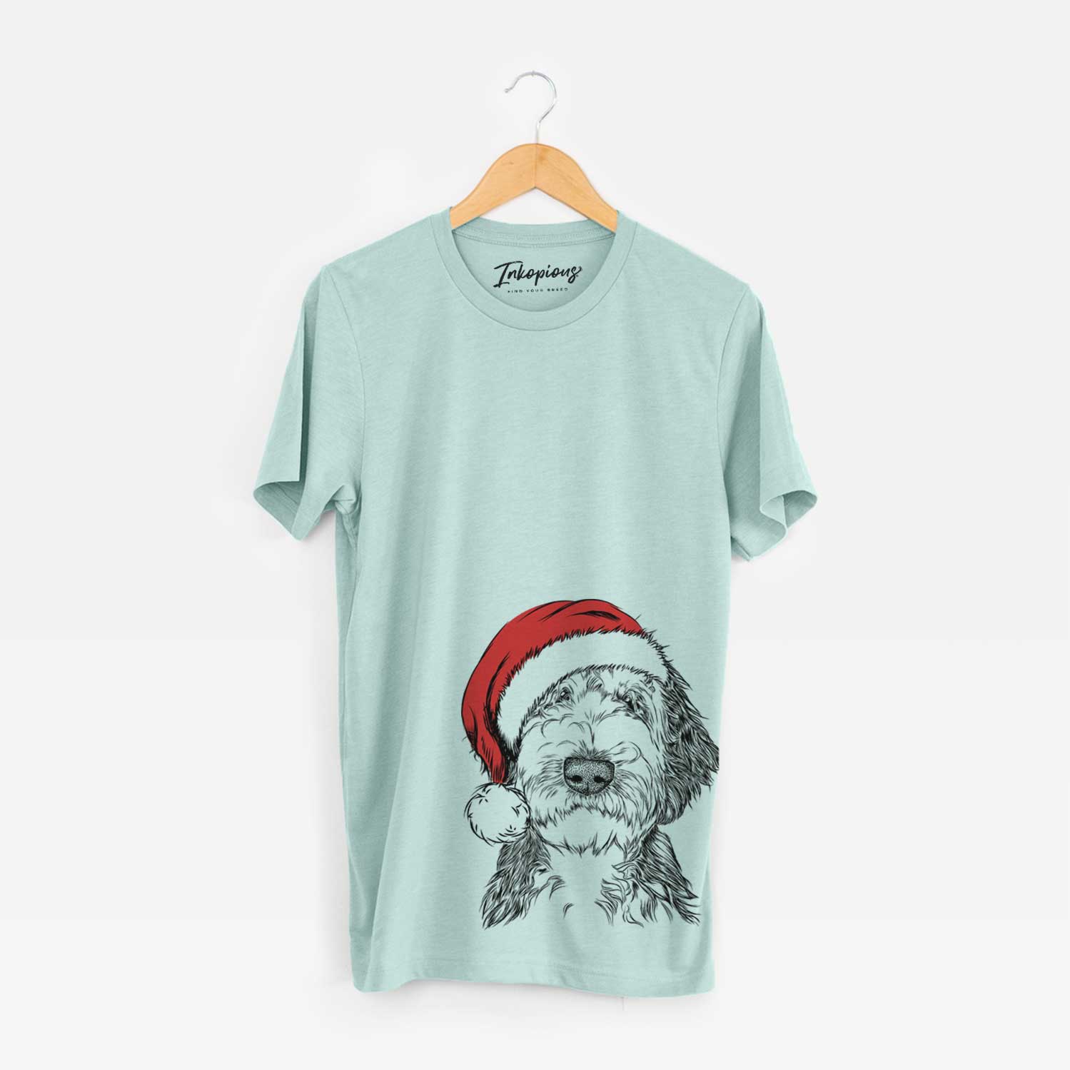 Hand-drawn sketch of Milo Fluff the Sheepadoodle wearing a Santa hat on a Heather Sage Unisex crewneck